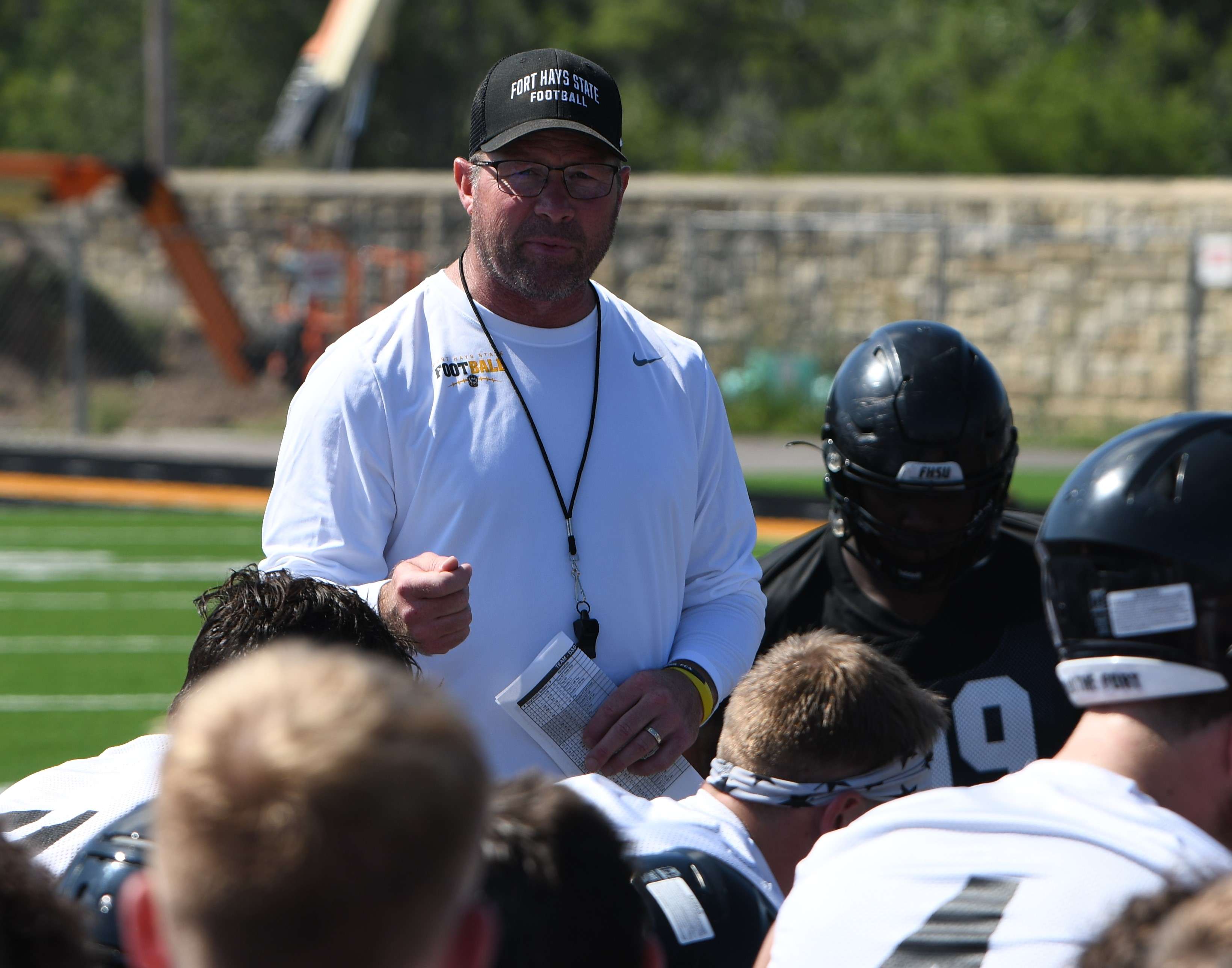 Fort Hays State head football coach Chris Brown addresses his team following their first practice of preseason camp (FHSU Athletics photo/Ryan Prickett)