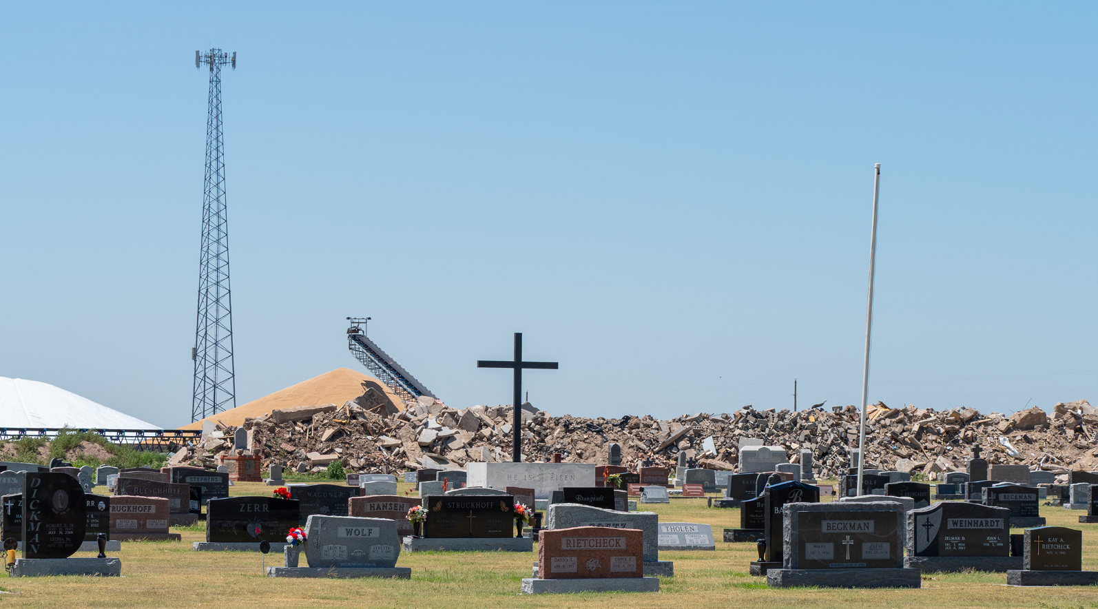 Rubble from the May tornado can be seen on July 9, 2025, in Grinnell. Cemeteries had headstone damage and 28 homes were destroyed. (Sherman Smith/Kansas Reflector)