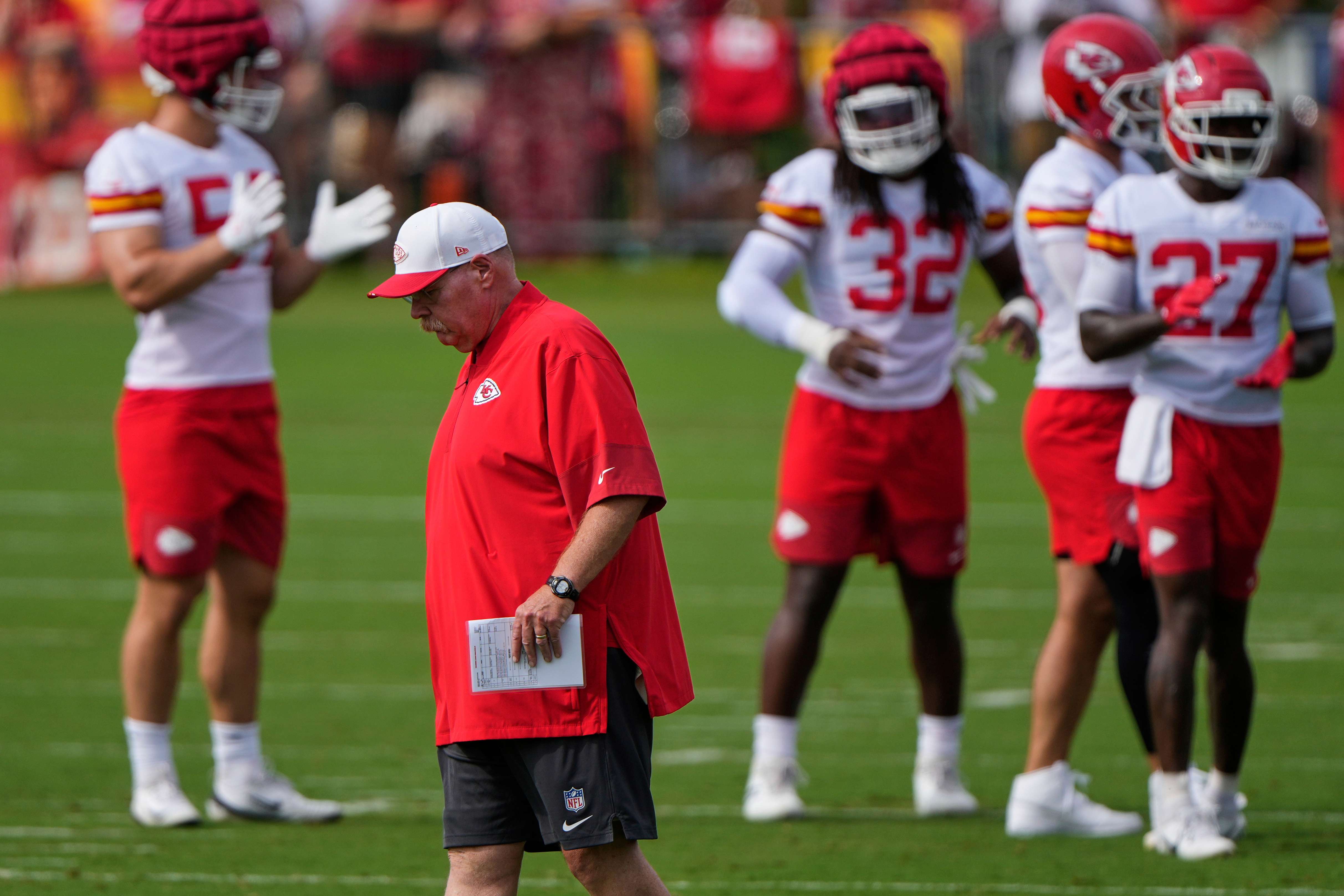 Kansas City Chiefs head coach Andy Reid walks between drills at NFL football training camp Tuesday, July 22, 2025, in St. Joseph, Mo. (AP Photo/Charlie Riedel)