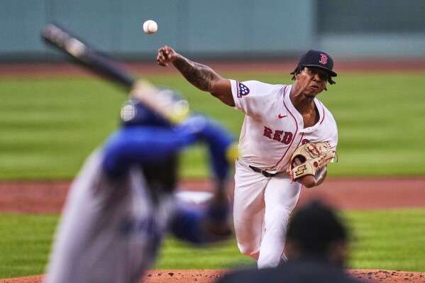 Boston Red Sox pitcher Brayan Bello delivers during the first inning of a baseball game against the Kansas City Royals at Fenway Park, Monday, Aug. 4, 2025, in Boston. (AP Photo/Charles Krupa)