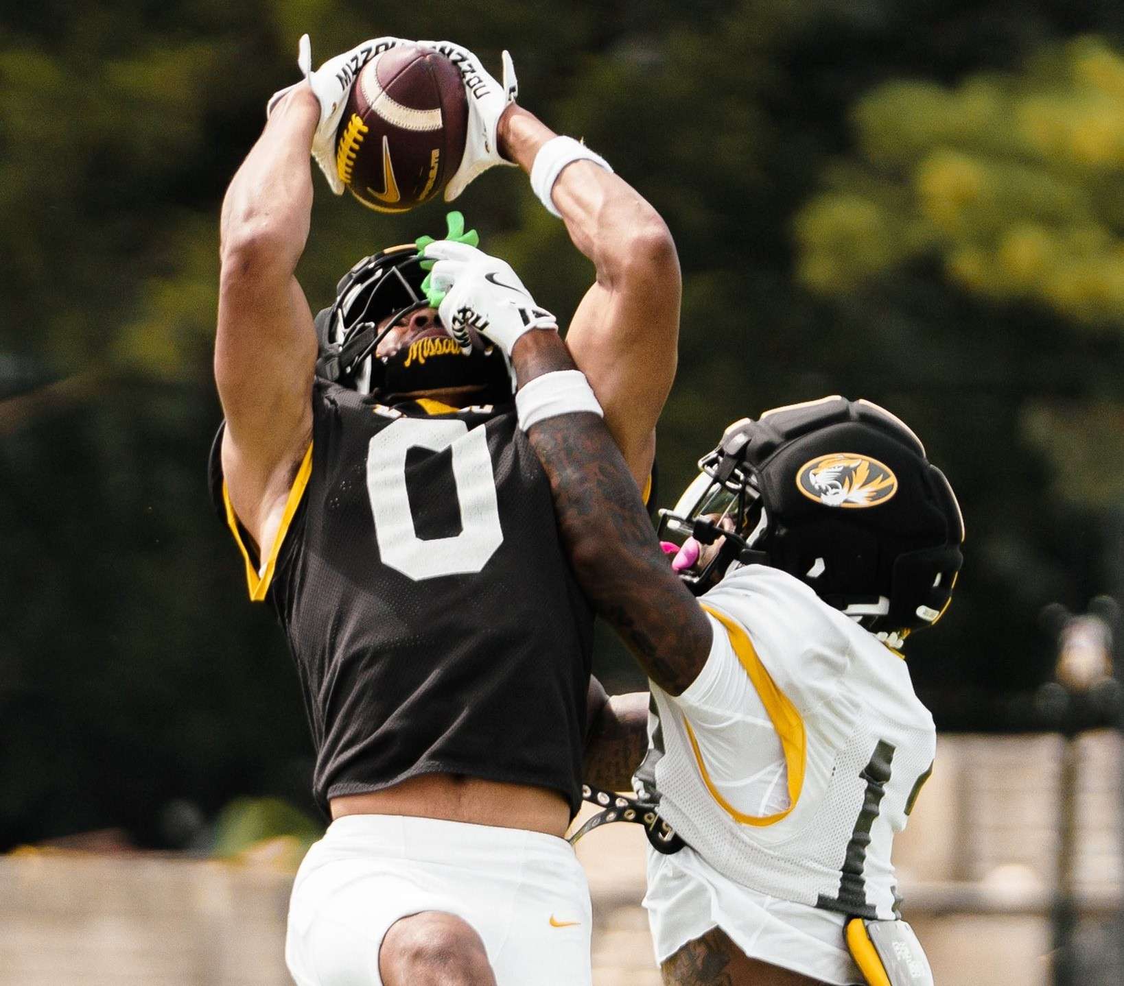 Missouri wide receiver Joshua Manning (0) goes up for a catch against Daylan Carnell/ Photo courtesy of Mizzou football on X