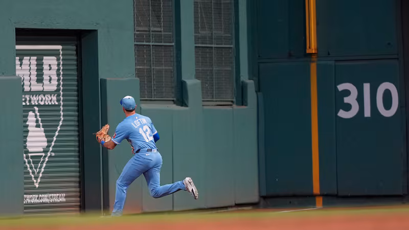 Kansas City Royals outfielder Nick Loftin fields a hit off the Green Monster in left field by Boston Red Sox Jarren Duran in the third inning of a baseball game, Tuesday, Aug. 5, 2025, in Boston. (AP Photo/Robert F. Bukaty)