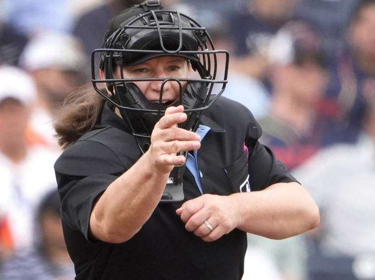 Home plate umpire Jen Pawol calls a striek during the third inning of a spring training baseball game between the Miami Marlins and Houston Astros, Sunday, March 10, 2024, in West Palm Beach, Fla. (AP Photo/Jeff Roberson, File)