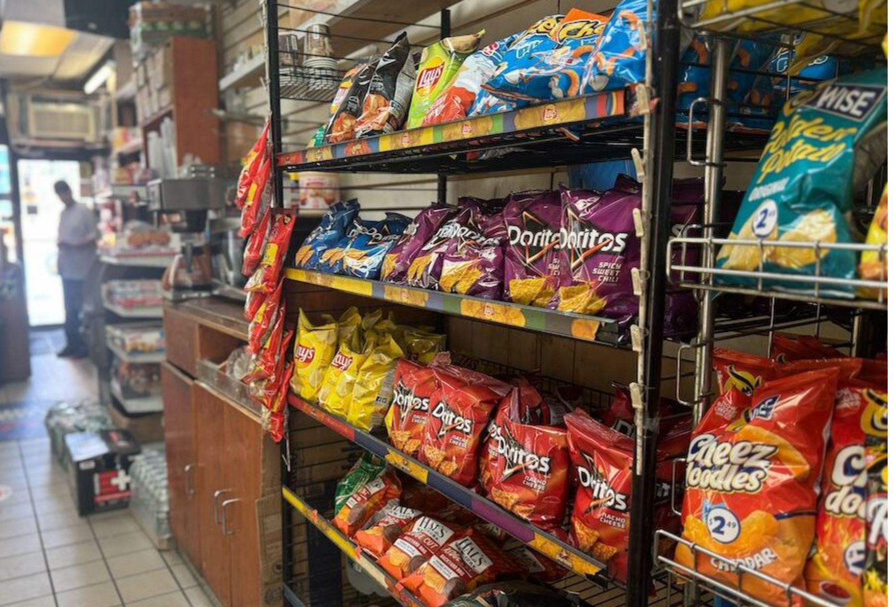 Sodas and chips are displayed at a convenience store in the Astoria neighborhood of Queens in New York. As of this month, 12 states, mostly Republican and in the South, have opted to limit SNAP recipients from purchasing foods such as soda and candy (Shalina Chatlani/ Stateline).