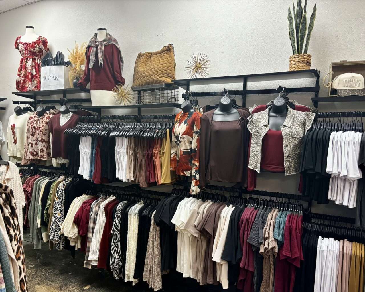 A wall of clothing at Sugar Collective at Big Creek Crossing in Hays. Photo by Tony Guerrero/Hays Post
