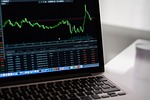 Wall Street edges up to more records following a worldwide rally