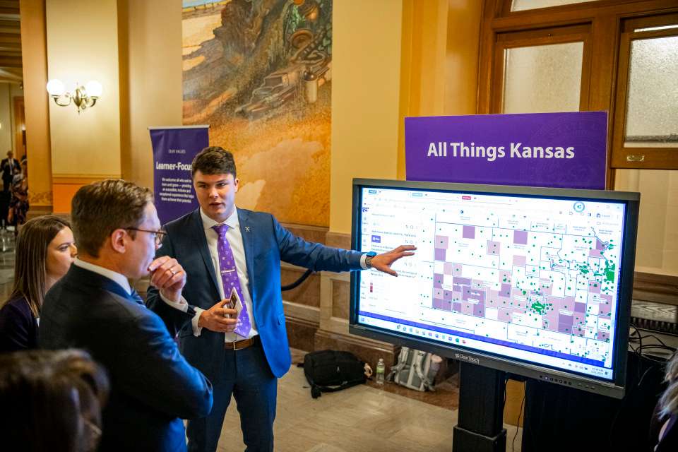 Parker Vulgamore, 2022-23 student body president, discusses All Things Kansas with Kansas Lt. Gov. and Secretary of Commerce David Toland during K-State Impact Day. Photo courtesy KSU