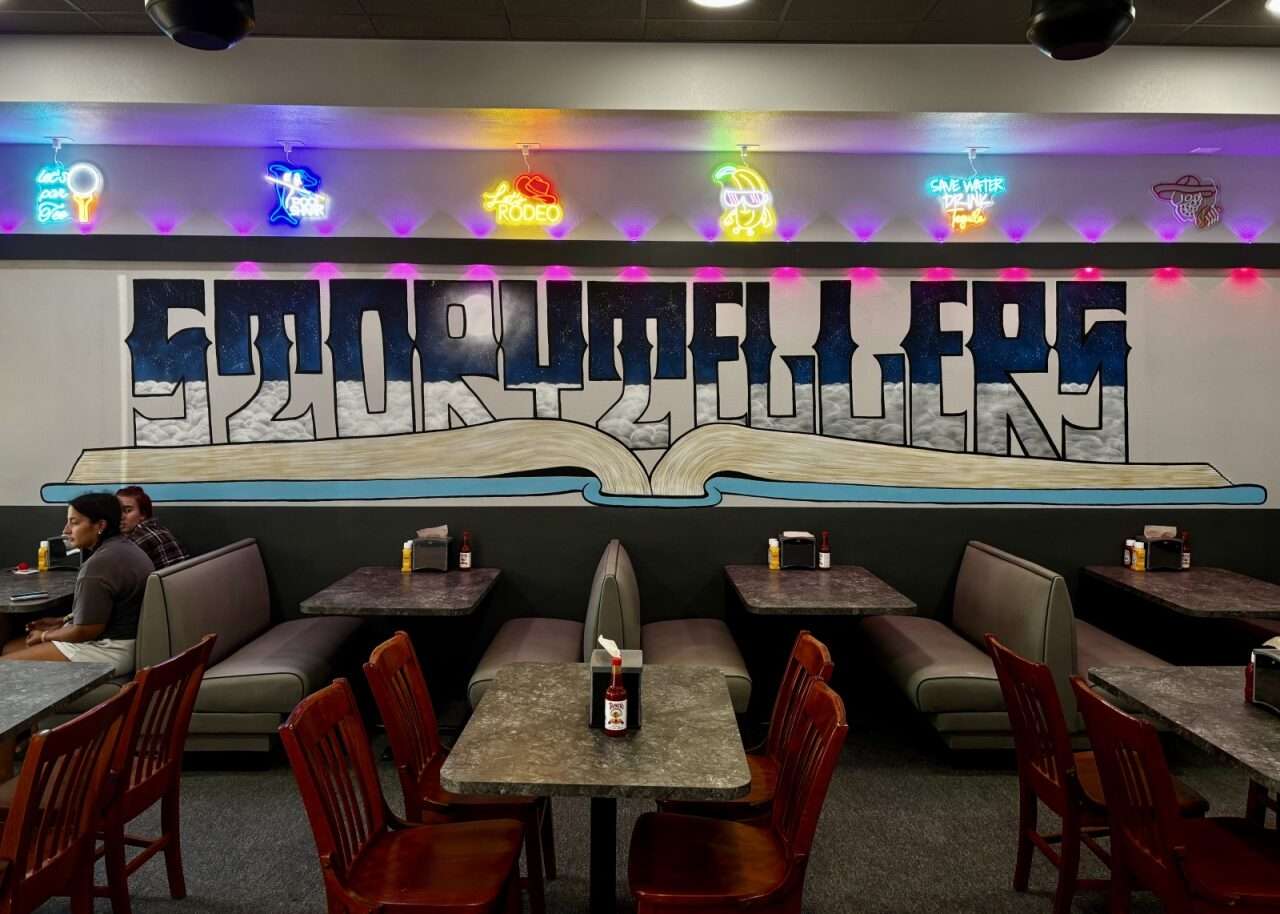 Wall art and decorations above booths at Storytellers in Hays. Photo by Tony Guerrero/Hays Post
