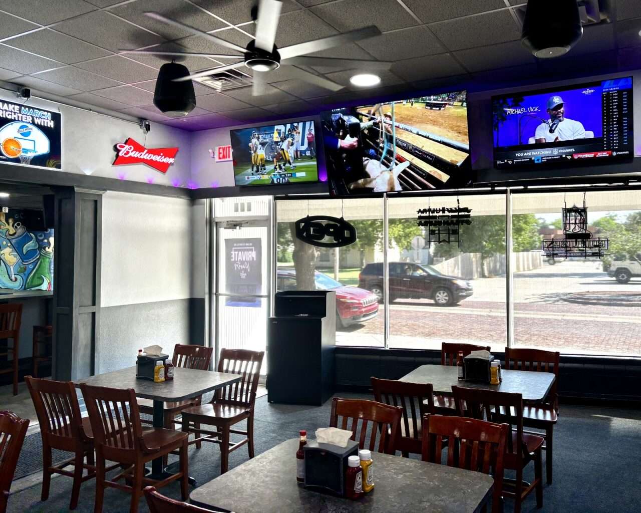 Televisions mounted above the main seating area of Storytellers in Hays. Photo by Tony Guerrero/Hays Post