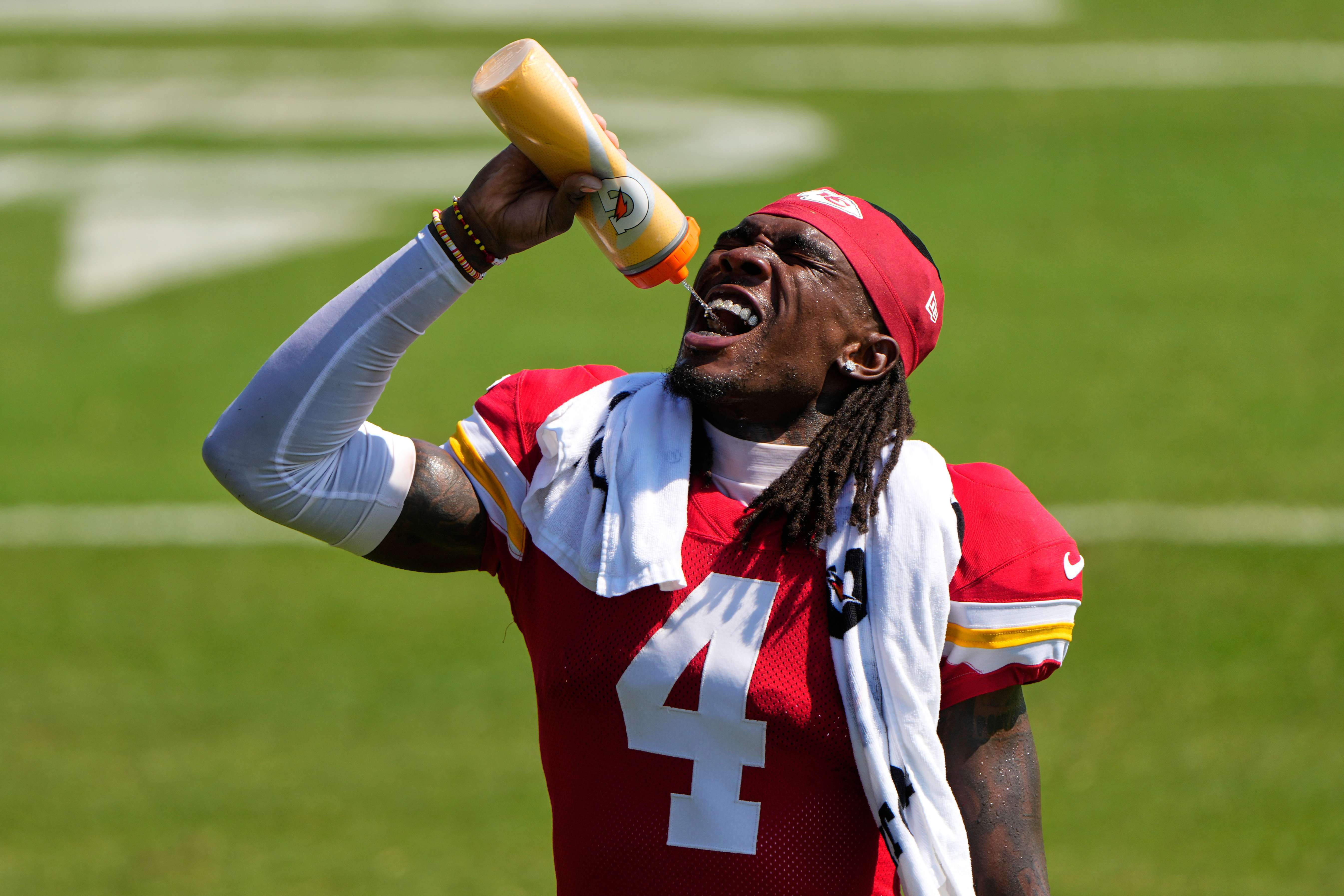Kansas City Chiefs wide receiver Rashee Rice takes a drink during Back Together Weekend at the team's NFL football training camp, Sunday, July 27, 2025, in St. Joseph, Mo. (AP Photo/Charlie Riedel)