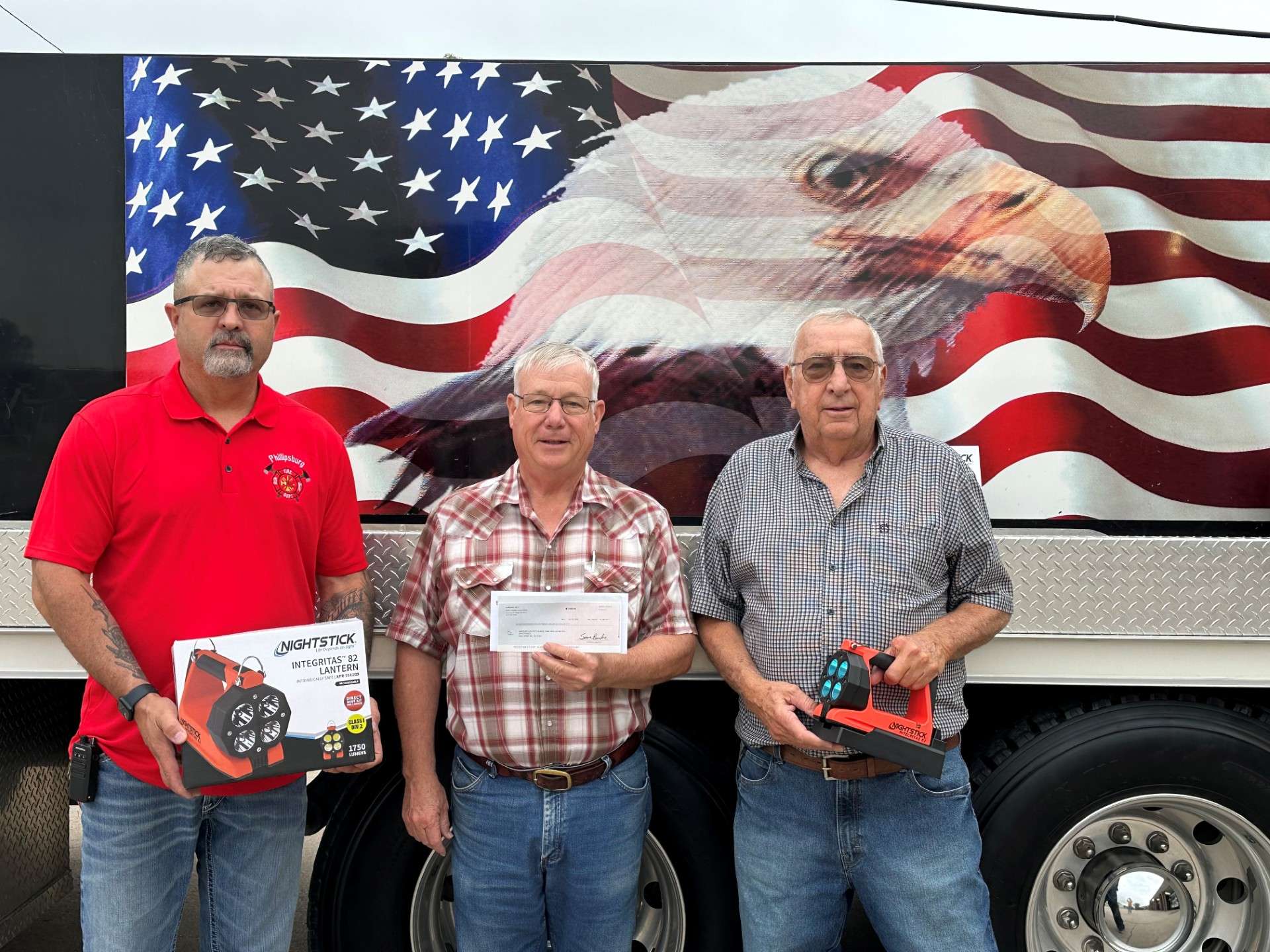 Pictured from left to right are Phillipsburg Fire Chief Jeremiah Clancy, Trinity Ag CEO Bruce Williams, and Long Island Fire Chief Gary Hammond. Courtesy photo