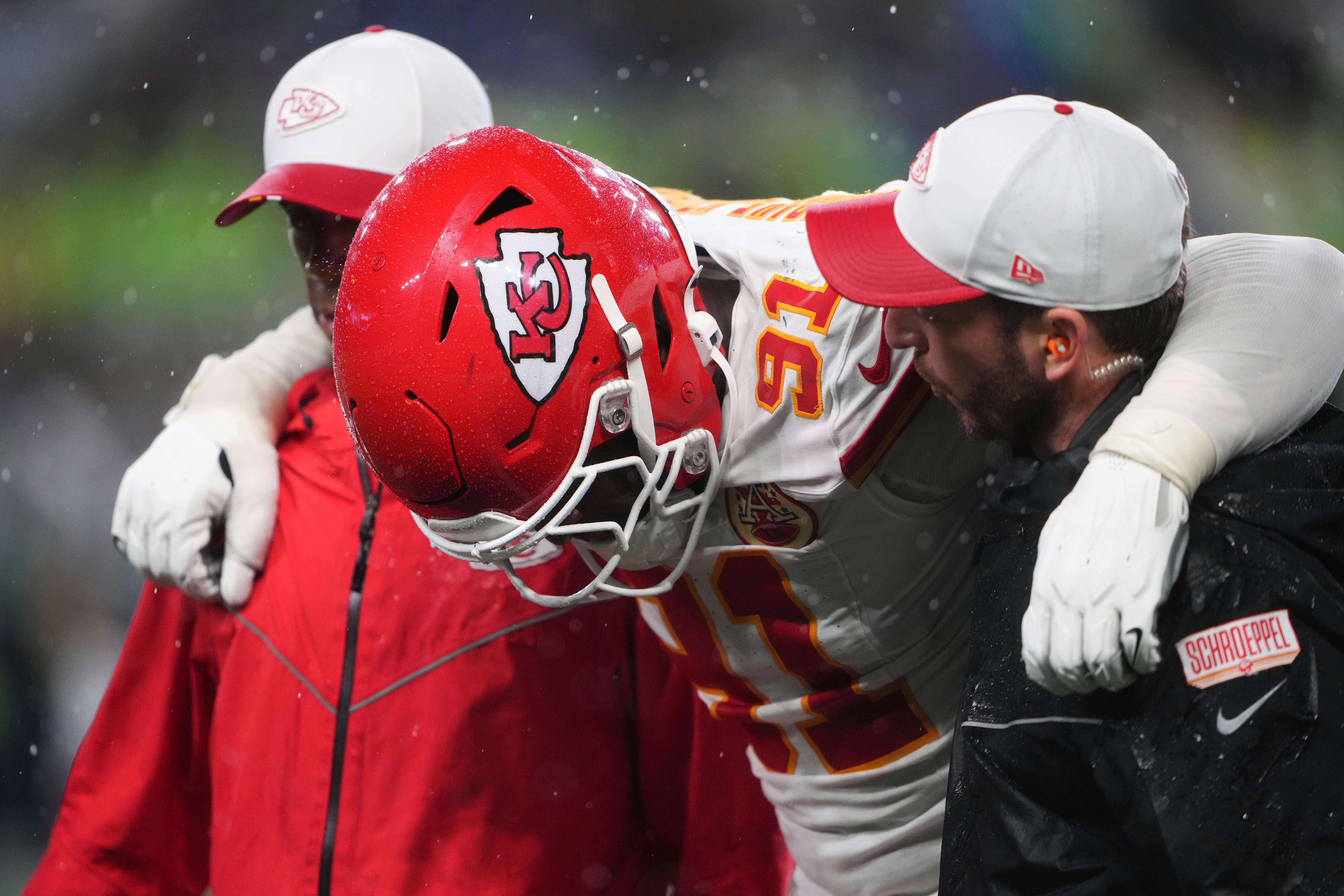 Kansas City Chiefs defensive end Felix Anudike-Uzomah (91) is helped off the field after a play during the second half of an NFL preseason football game against the Seattle Seahawks, Friday, Aug. 15, 2025, in Seattle. (AP Photo/Lindsey Wasson)