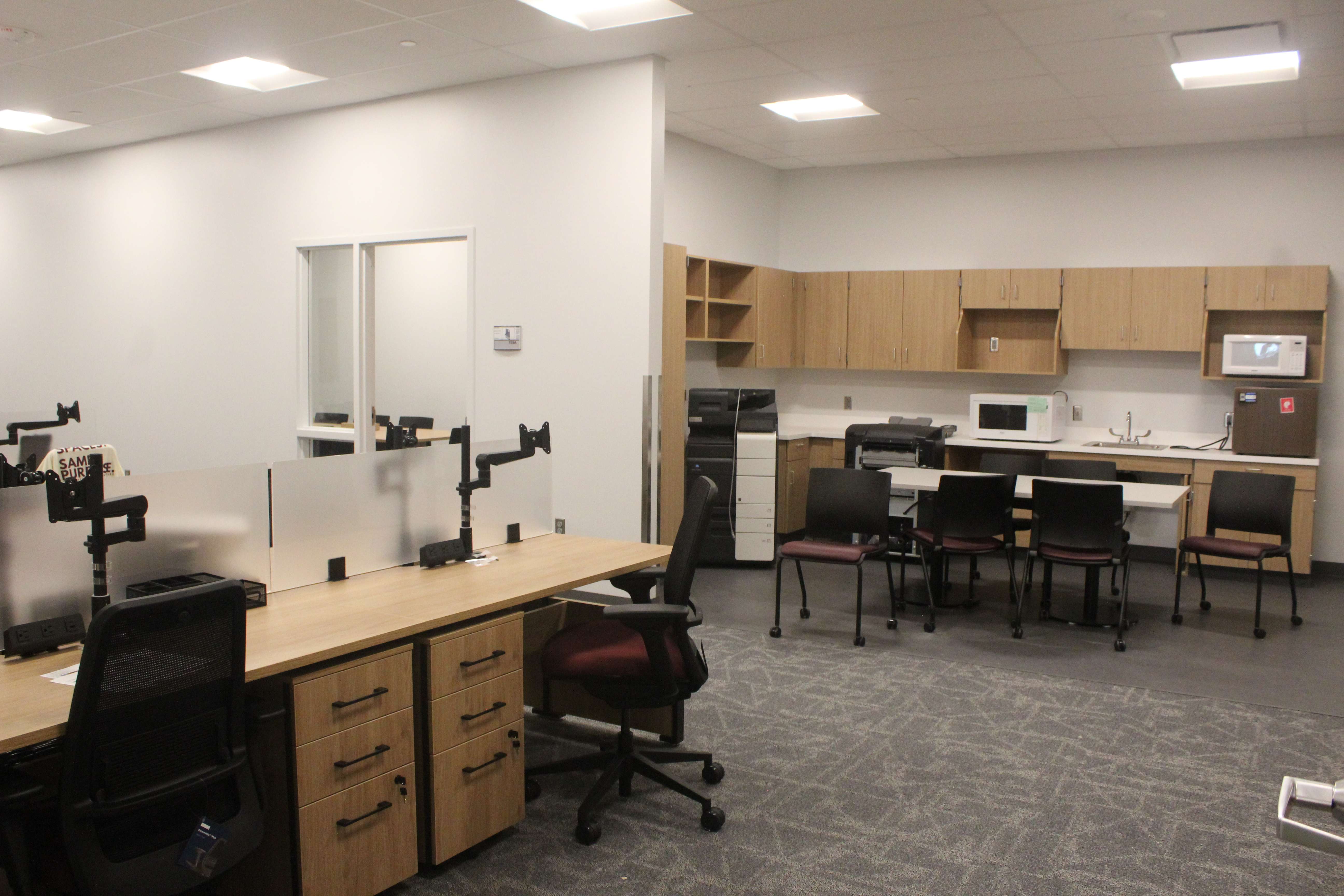 Teacher work space. Because teachers have this workspace, classrooms can be used all hours of the day if needed, and teachers can work in one of these workrooms during their planning periods. Photo by Cristina Janney/Hays Post