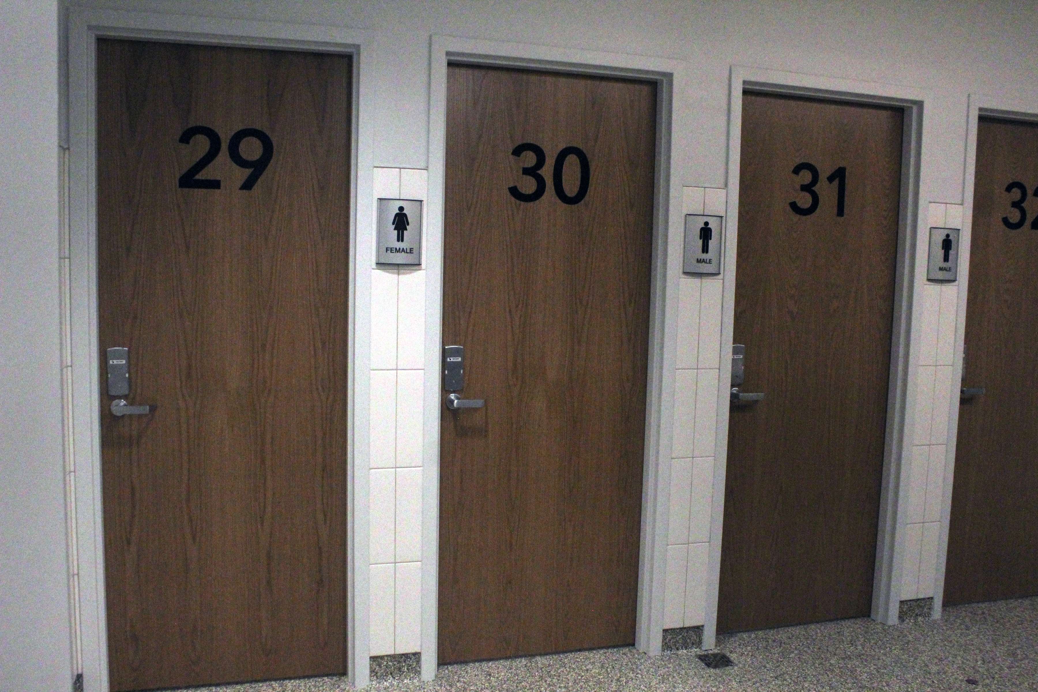 Some of the new private bathrooms at Hays High School. The stalls are installed with smoke detectors and cameras outside in the common areas. The stalls are labled male and female. Photo by Cristina Janney/Hays Post&nbsp;