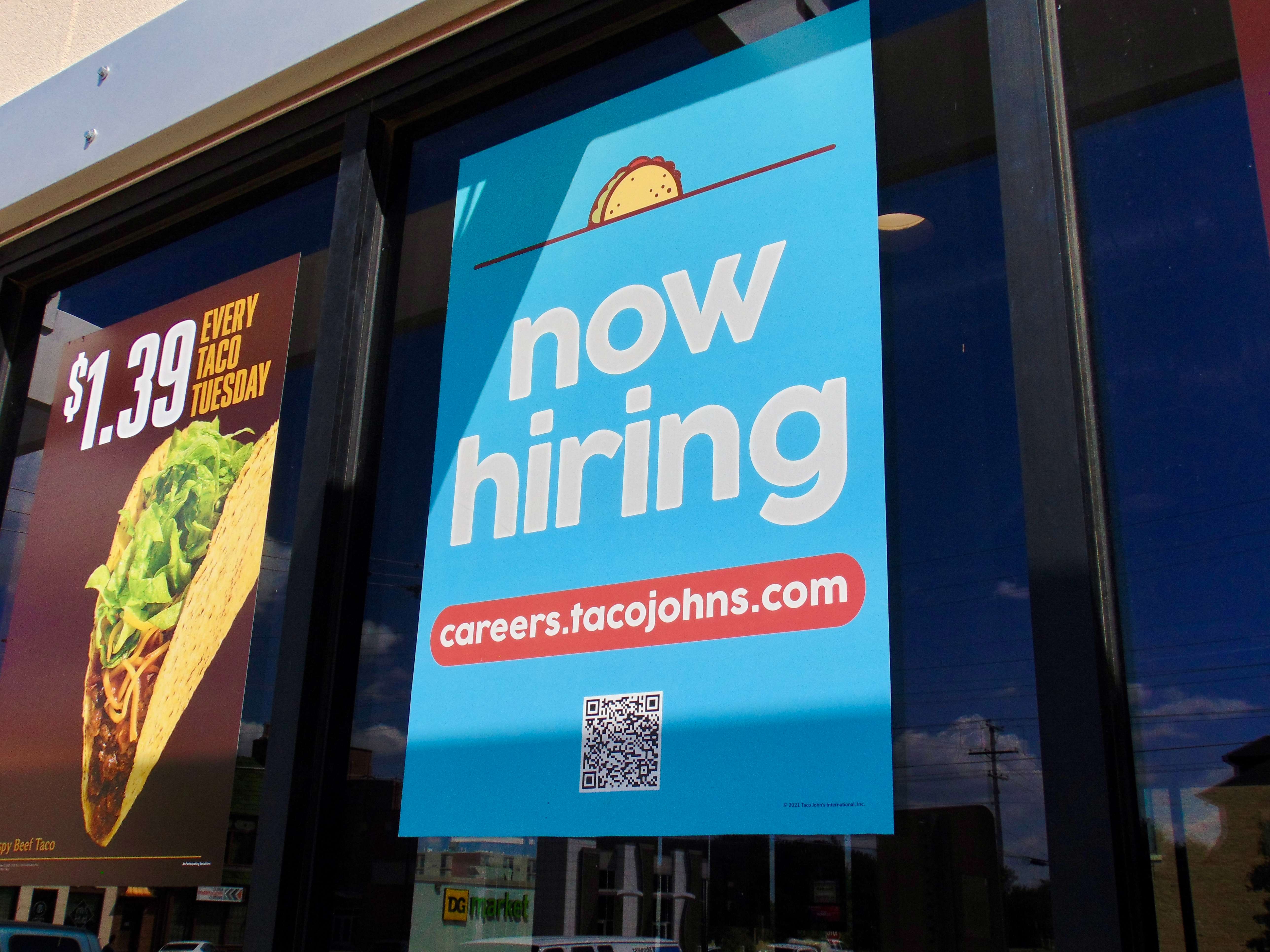 "Now Hiring" sign at the Taco John's on 418 E Iron Ave. Photo by Nicolas Fierro