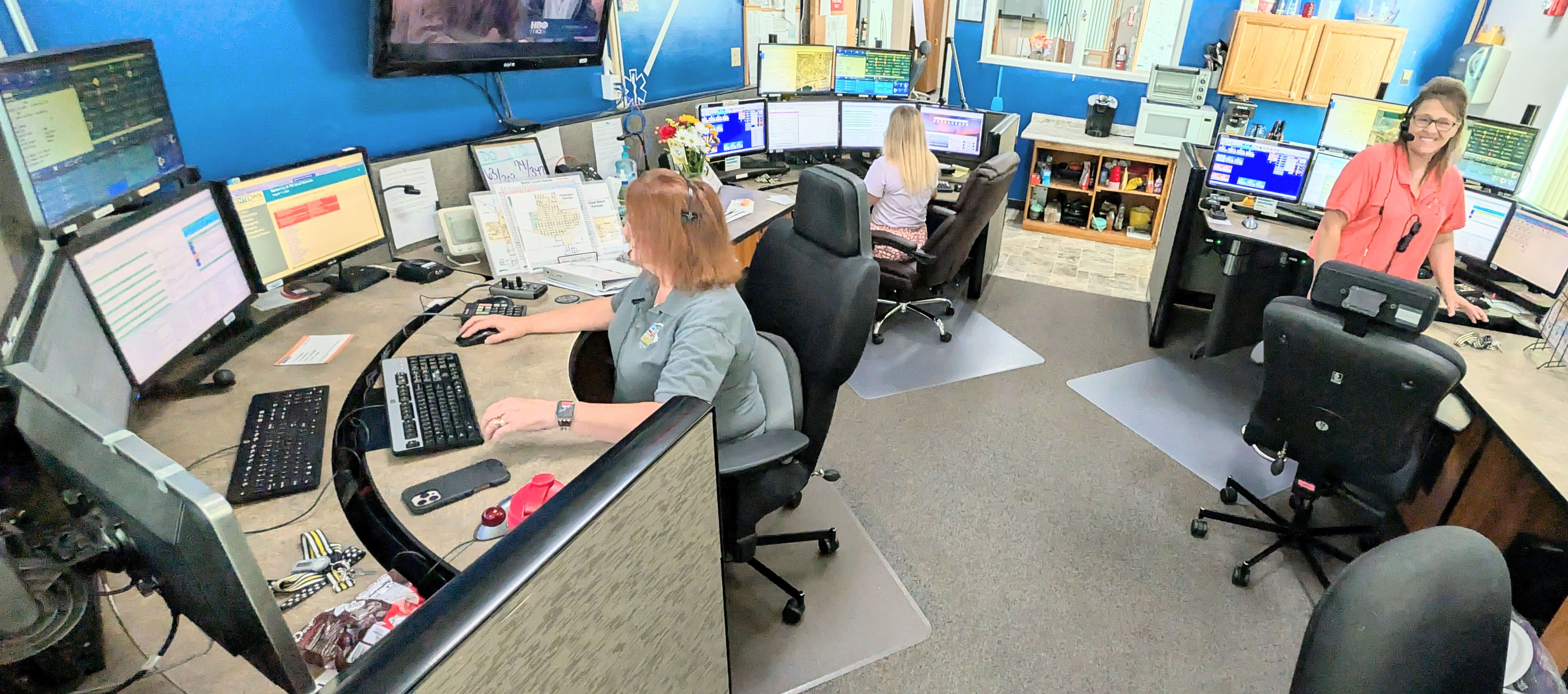 The team of dispatchers at the Barton County Communications Center takes calls on a quiet Monday afternoon, knowing that things could get crazy at any moment.