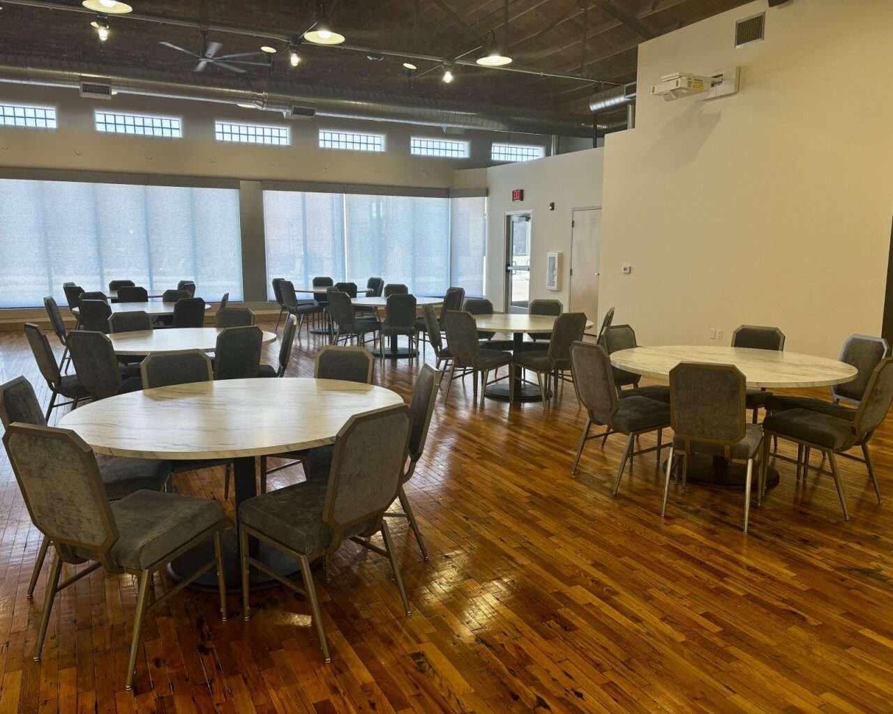 Chairs, tables and a projector at the event center next to Gella's Diner and LB Brewing in Hays. Photo by Tony Guerrero/Hays Post