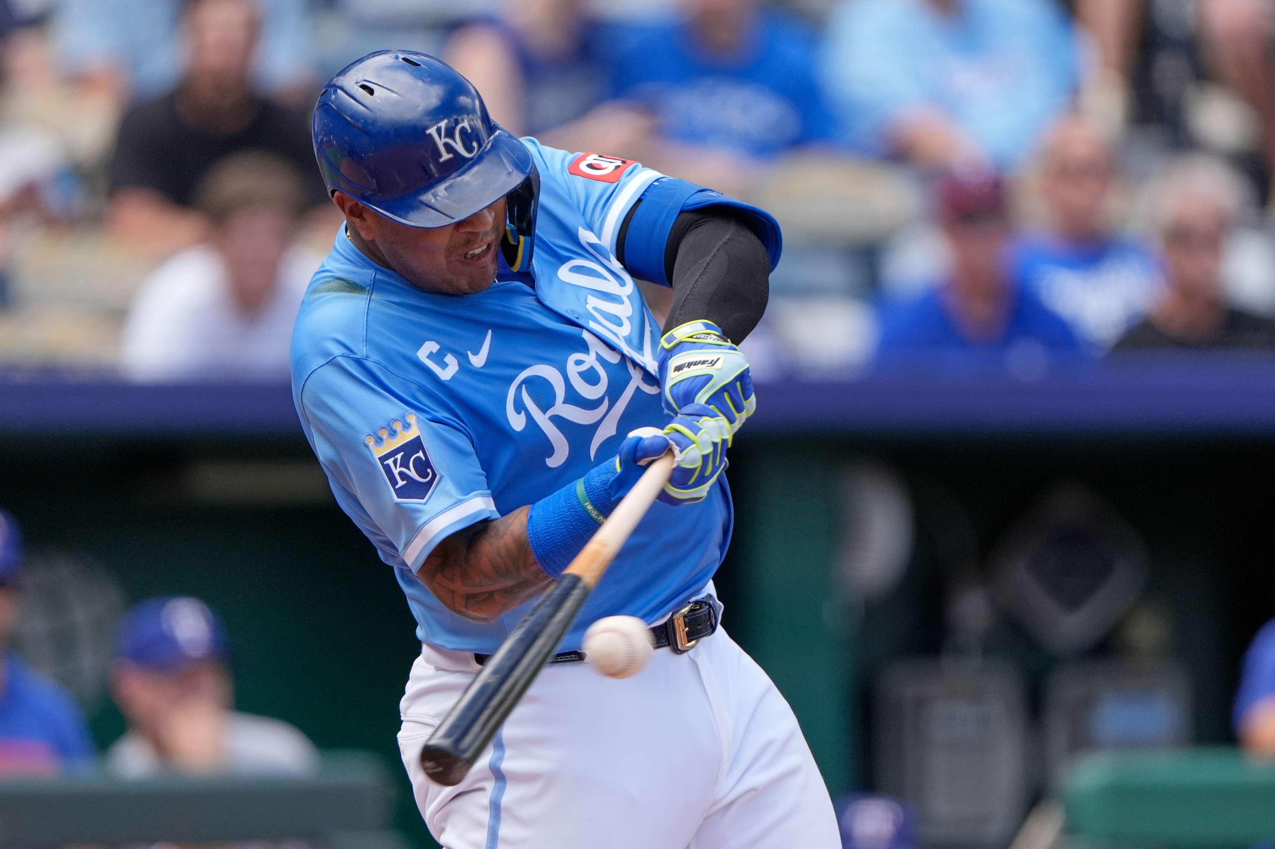 Kansas City Royals' Salvador Perez hits an RBI single during the third inning of a baseball game against the Texas Rangers, Thursday, Aug. 21, 2025, in Kansas City, Mo. (AP Photo/Charlie Riedel)