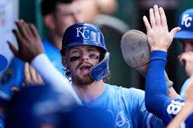Kansas City Royals' Bobby Witt Jr. celebrates in the dugout after scoring on an RBI single hit by Salvador Perez during the third inning of a baseball game against the Texas Rangers, Thursday, Aug. 21, 2025, in Kansas City, Mo. (AP Photo/Charlie Riedel)