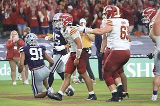 Iowa State Rocco Becht celebrates after scoring a touchdown during an NCAA college football game between Iowa State and Kansas State in Dublin, Ireland Saturday, Aug. 23, 2025. (AP Photo/Peter Morrison)