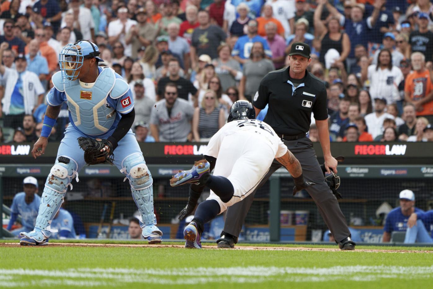 Detroit Tigers' Javier Báez slides safely into home plate during the third inning of a baseball game Kansas City Royals Saturday, Aug. 23, 2025, in Detroit. (AP Photo/Josh Boland )