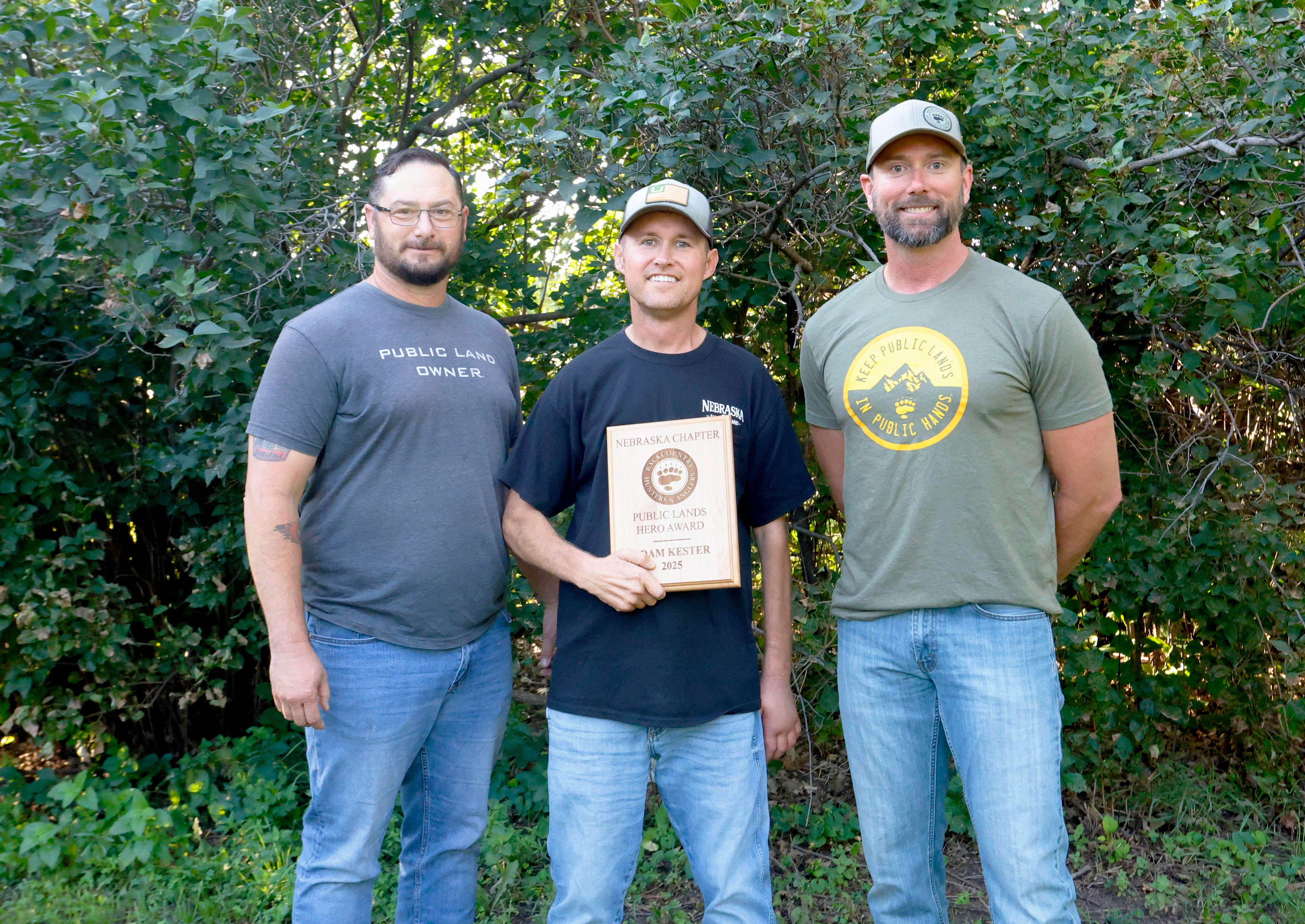 Adam Kester (middle), Nebraska Game and Parks Commission access program manager, accepts the Public Lands Hero Award from Bill Grossnicklaus (left) and Kyle Broadfoot, both Backcountry Hunters and Anglers board members.