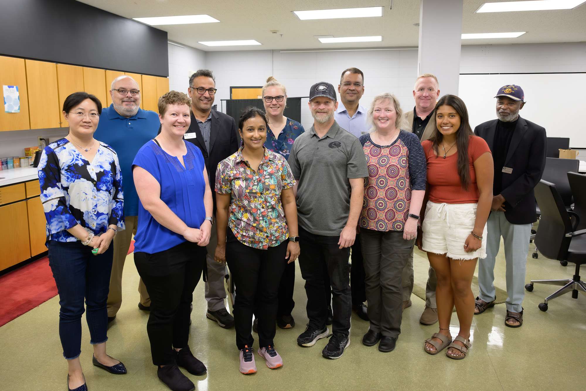 New Chadron State College faculty, August 2025. From left: Ruizhu Dai, Brett Greenwald, Rachel McKinley, M'bark Baddouh, Diya Ganguly, Jessica Meyers, Brian Grob, Amir Manzoor, Karla Abshire, Stephen Forsha, Jazlyn Reitz, and John Atsu-Swanzy. Not pictured: William Soto. (Photo by Daniel Binkard/Chadron State College)