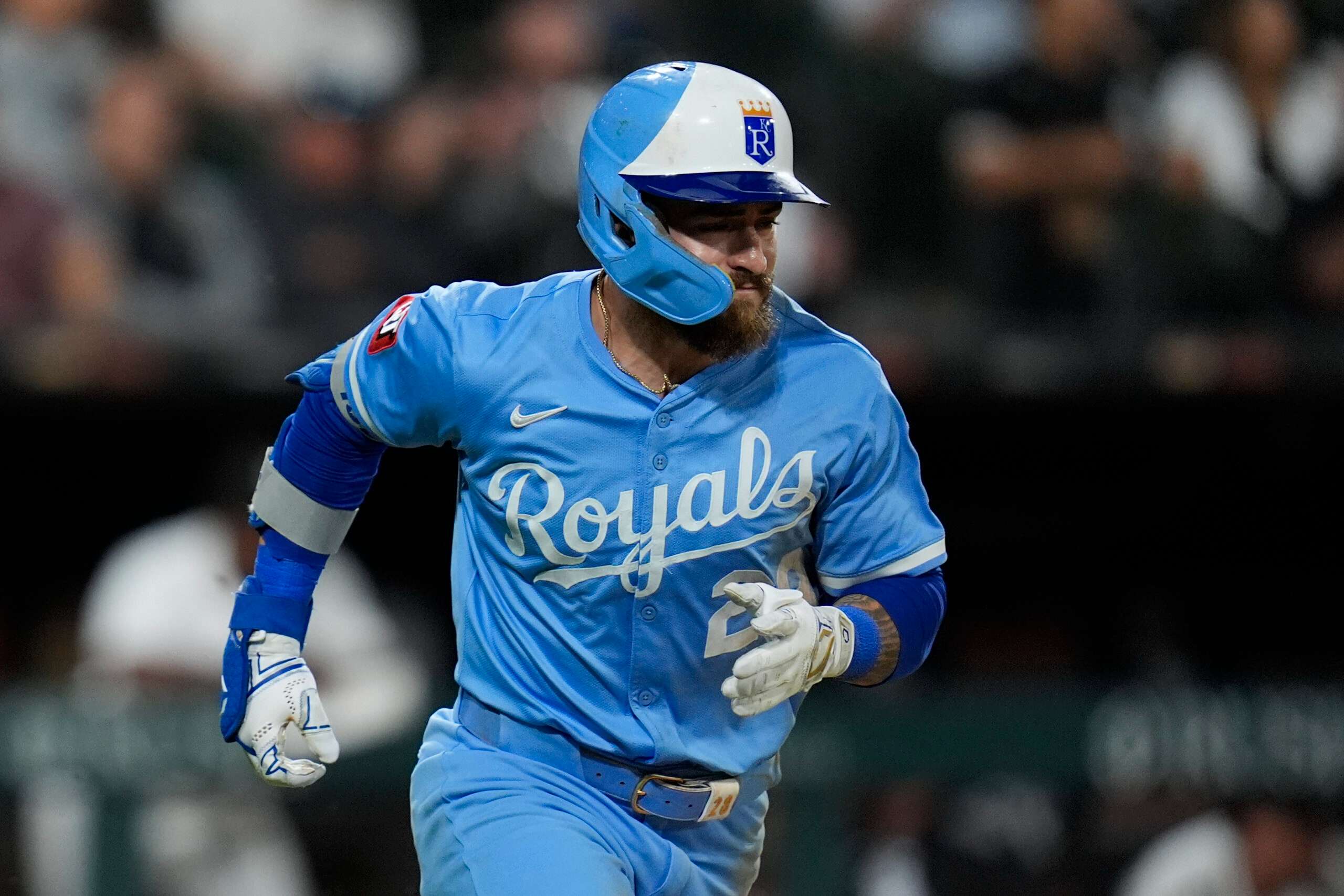 Kansas City Royals' Kyle Isbel runs to first after hitting a one-run single during the ninth inning of a baseball game against the Chicago White Sox, Tuesday, Aug. 26, 2025, in Chicago. (AP Photo/Erin Hooley)