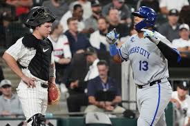 Kansas City Royals' Salvador Perez, right, celebrates after hitting a solo home run as Chicago White Sox catcher Kyle Teel looks down during the fifth inning of a baseball game in Chicago, Wednesday, Aug. 27, 2025. (AP Photo/Nam Y. Huh)