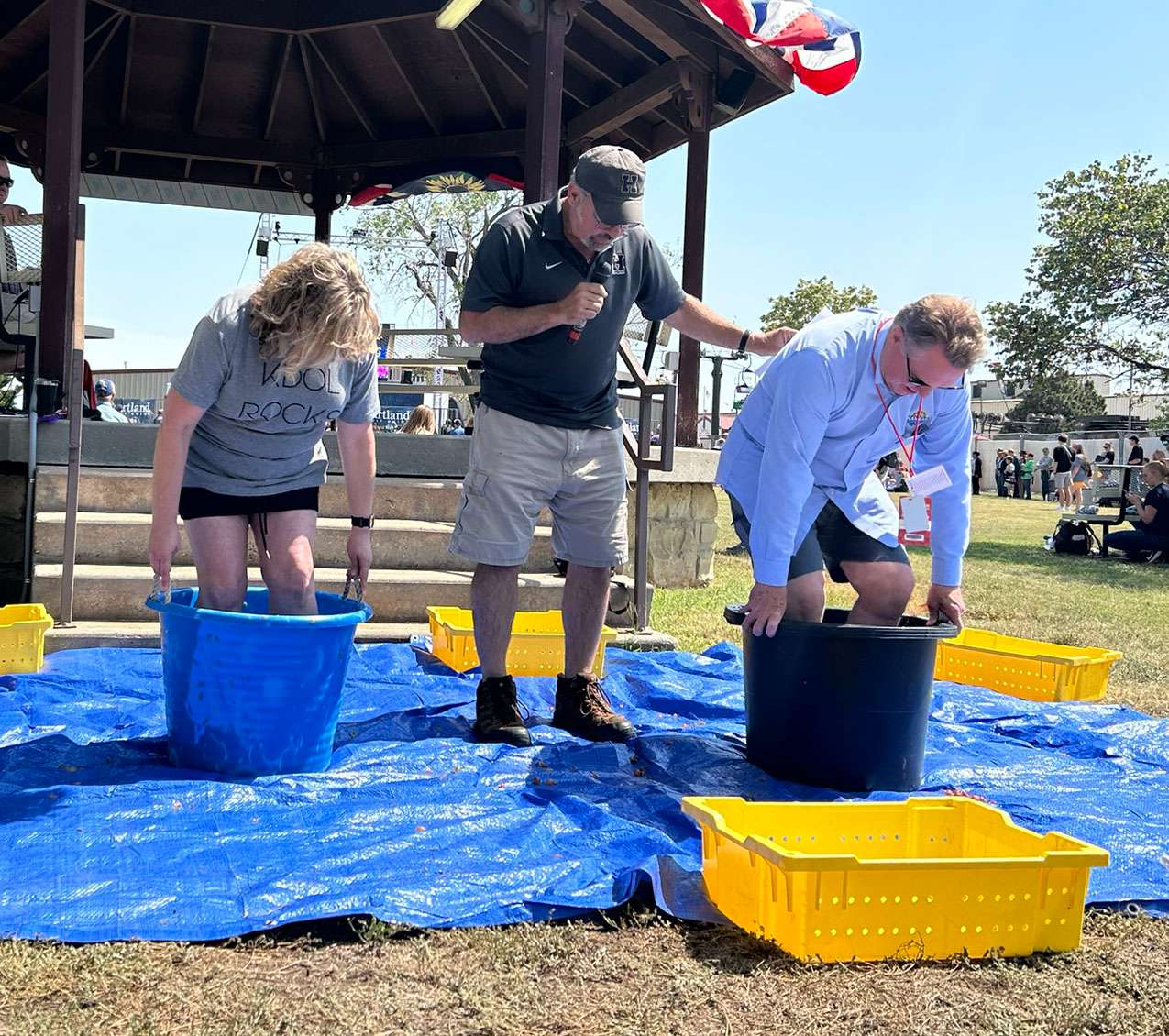 Secretary of Agriculture Mike Beam competed against Secretary of Labor Amber Schultz during the 2024 Kansas Grape Stomp at the Kansas State Fair in Hutchinson. Courtesy of Kansas Department of Agriculture