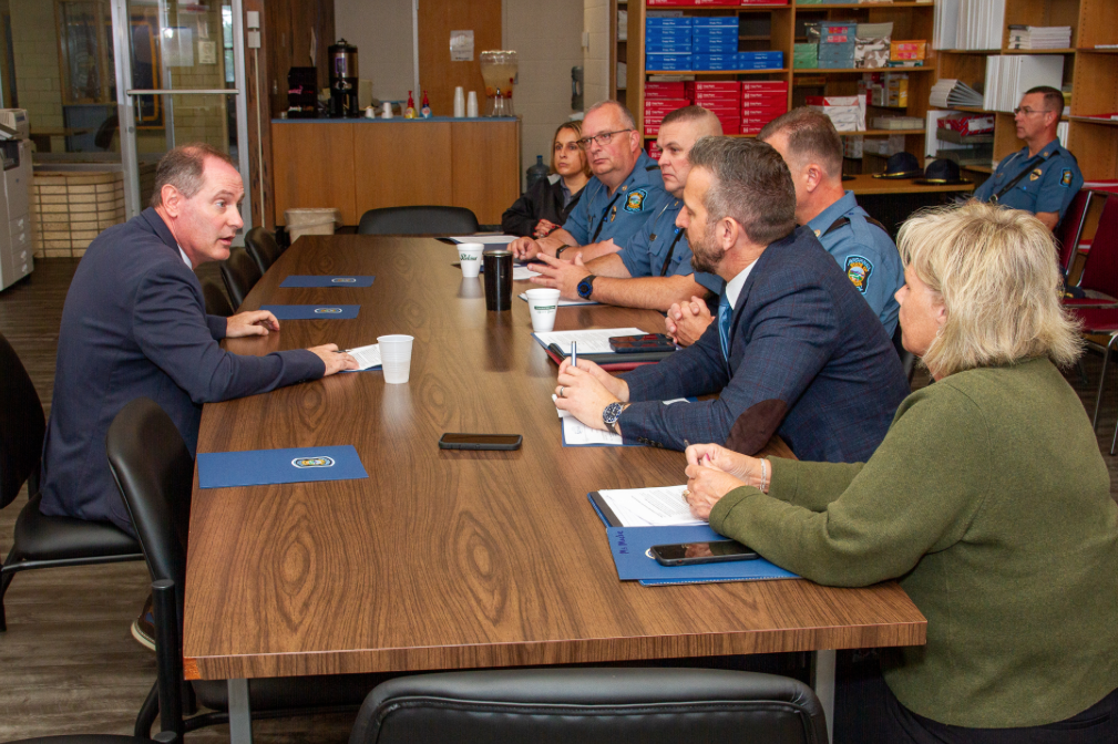 Rep. Mann speaking with KHP officials on the morning of Thursday, August 28 in Salina. Courtesy of Kansas Highway Patrol
