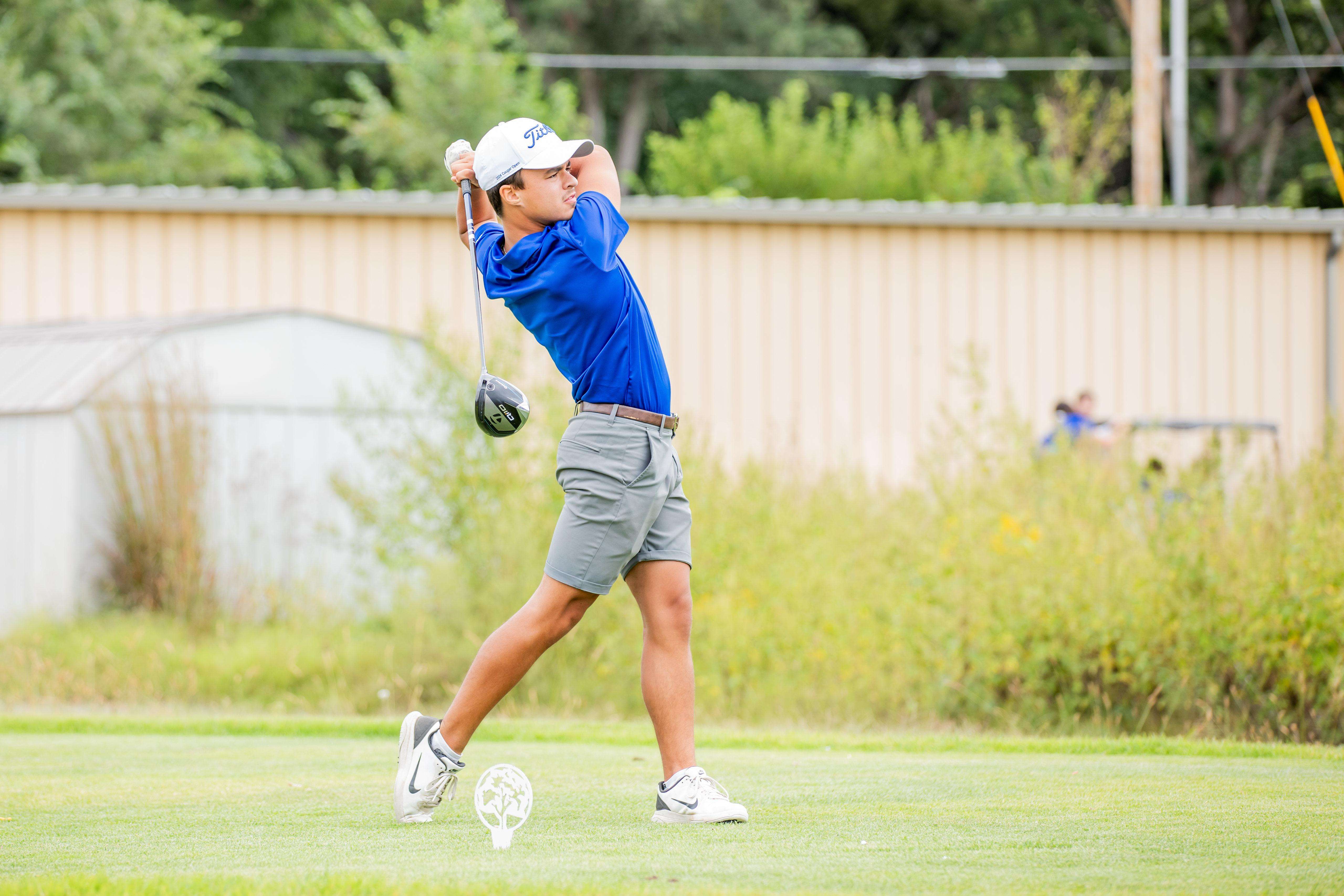 A member of the Barton men’s golf team looks on after his drive at the 2024 Wounded Warrior Golf Scramble. The scramble, scheduled for Sept. 20, benefits wounded soldiers from Fort Riley.
