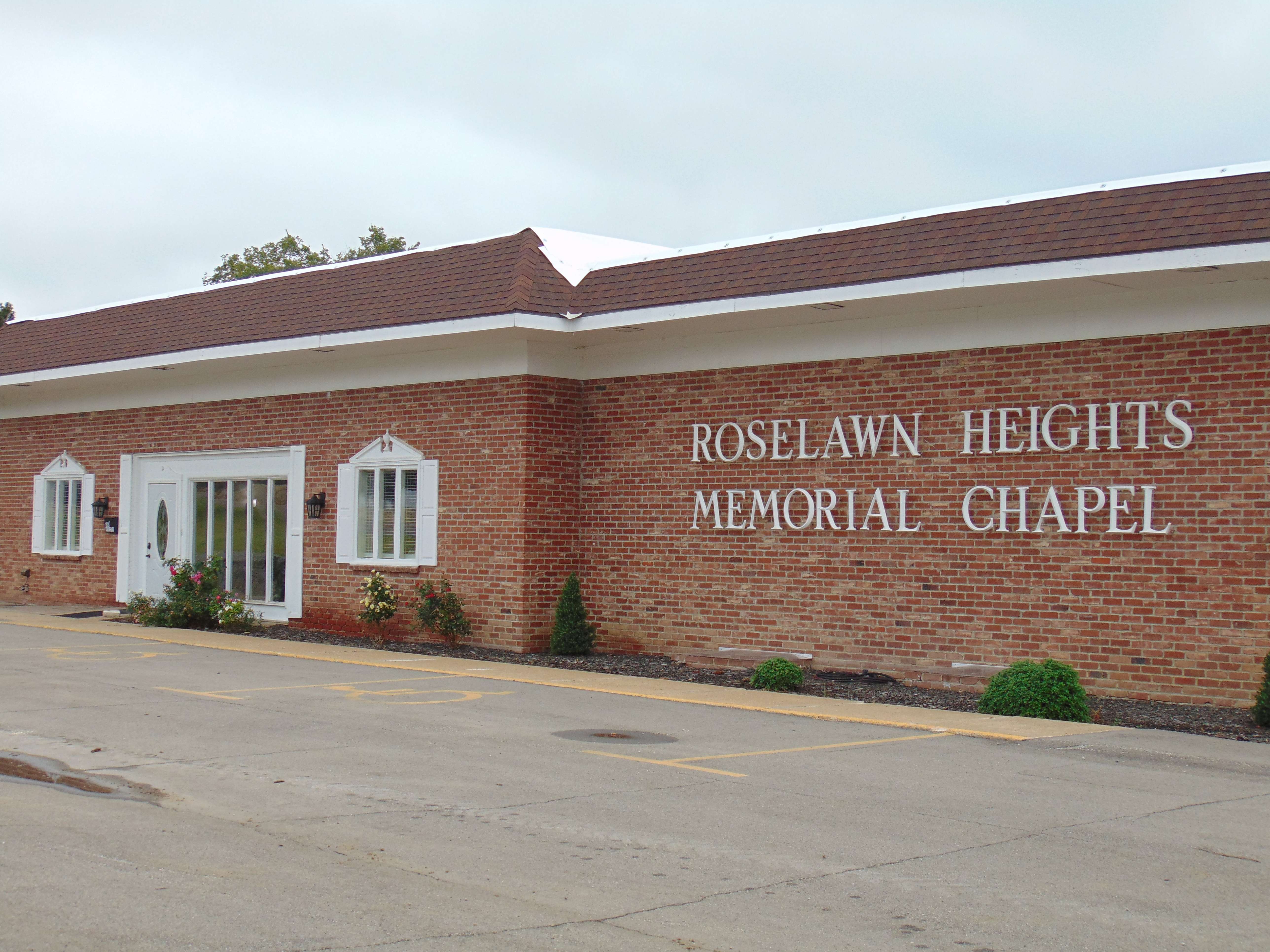 "Roselawn Heights Memorial Chapel" name sign on 1920 E. Crawford. Heier-Scott Mortuary and Cremations bought Roselawn on August 15, 2025. Owner/Founder of Heier Scott Mortuary and Cremations, Kara Heier-Scott plans on keeping the original Roselawn name sign due to its rich history. Photo by Nicolas Fierro