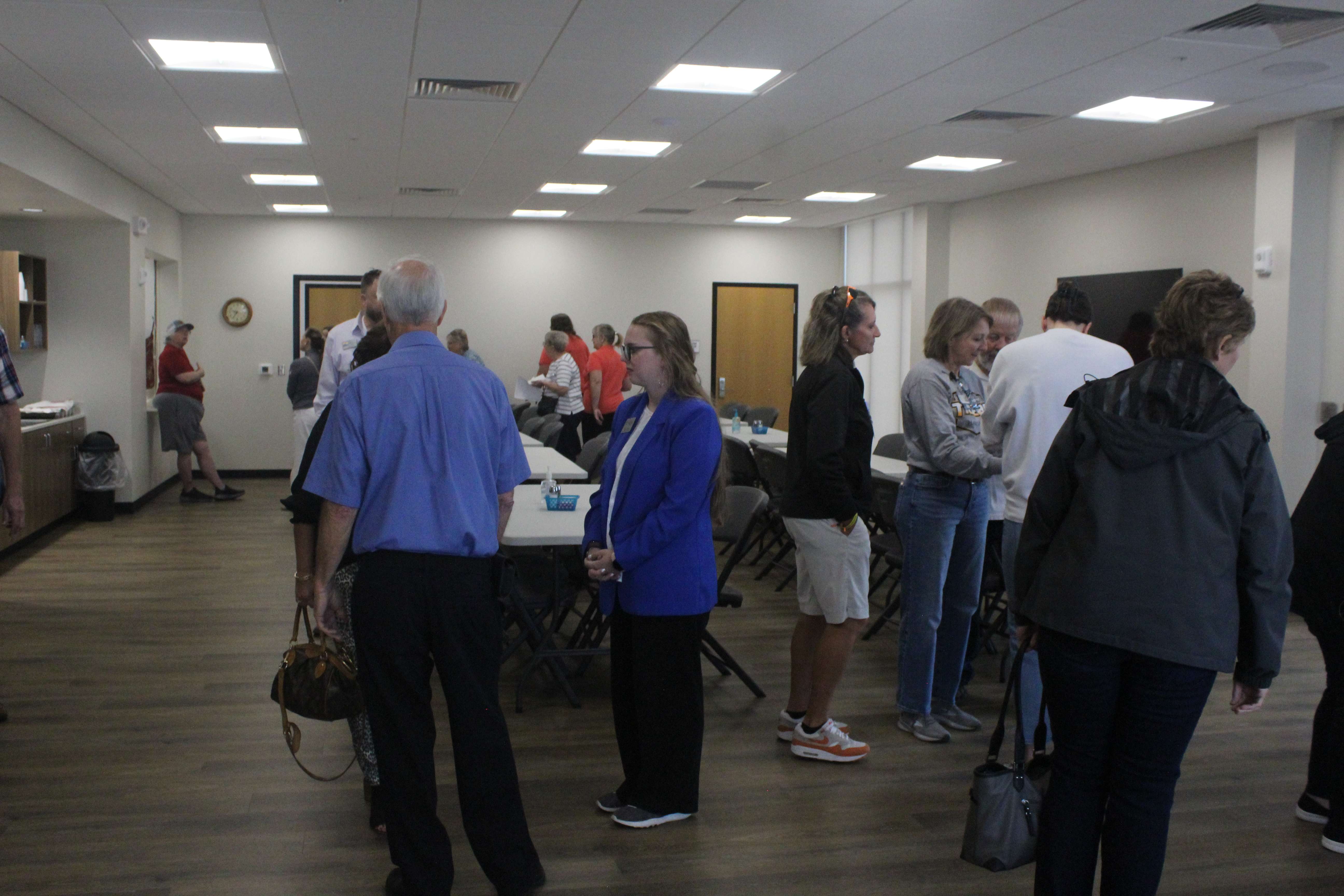People gather in the new space of the Hays Area Senior Center after the community center ribbon cutting. Photo by Cristina Janney/Hays Post