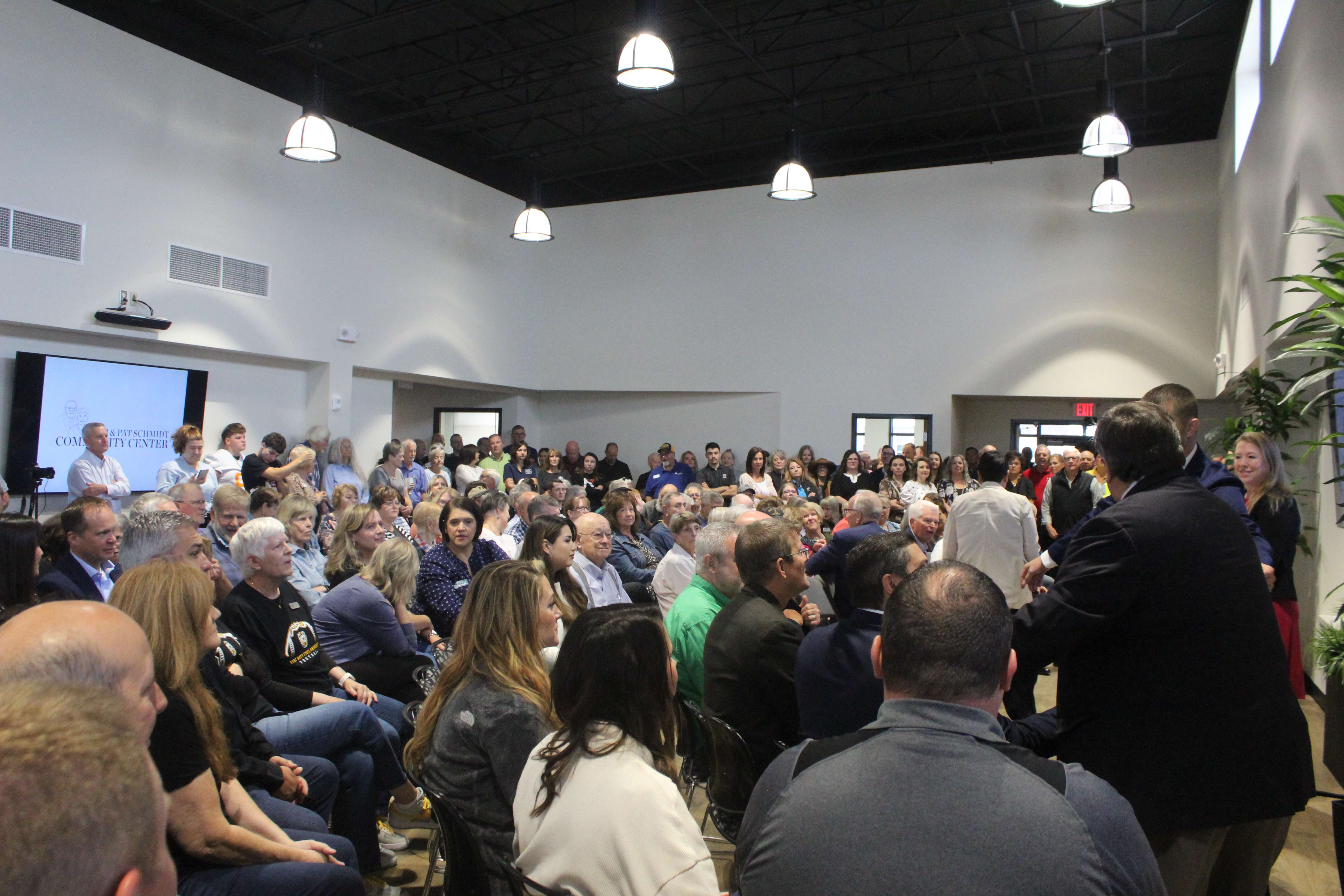 The ribbon-cutting ceremony for the Bob and Pat Schmidt Community Center was standing-room-only on Friday morning. Photo by Cristina Janney/Hays Post