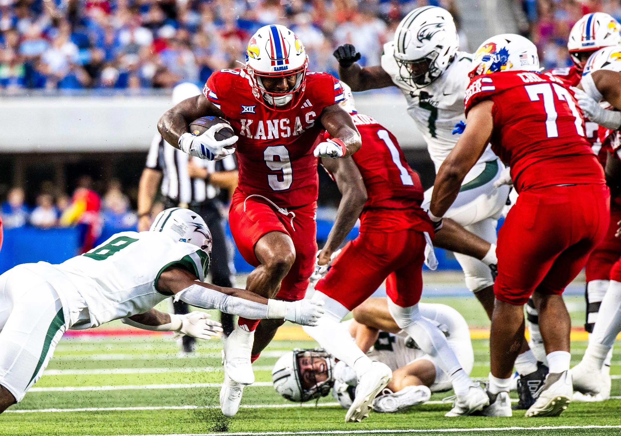Daniel Hishaw Jr. rushes for his first touchdown of the season in Kansas's 46-7 win over Wagner on Friday/ Photo courtesy of Kansas Football on X