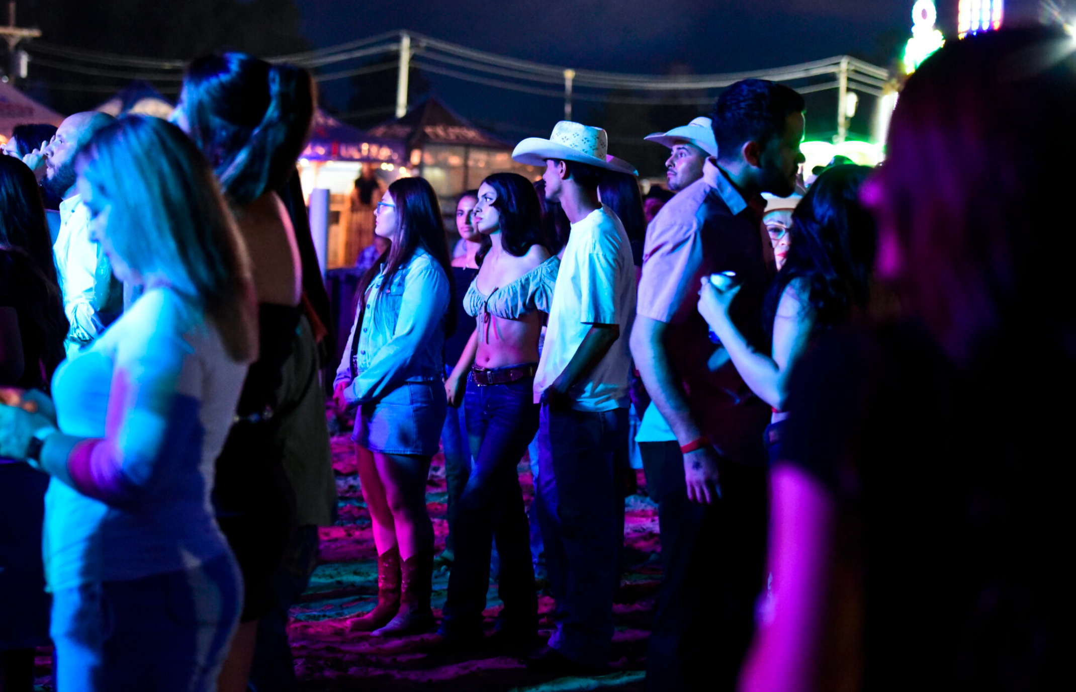 Concertgoers listen as La Fiera de Ojinaga performs at the Chase County Fair in Imperial on Aug. 14. Most Mexicans who call Imperial home hail from the northern state of Chihuahua, where the band is also from. (Bob Alberts/Flatwater Free Press)