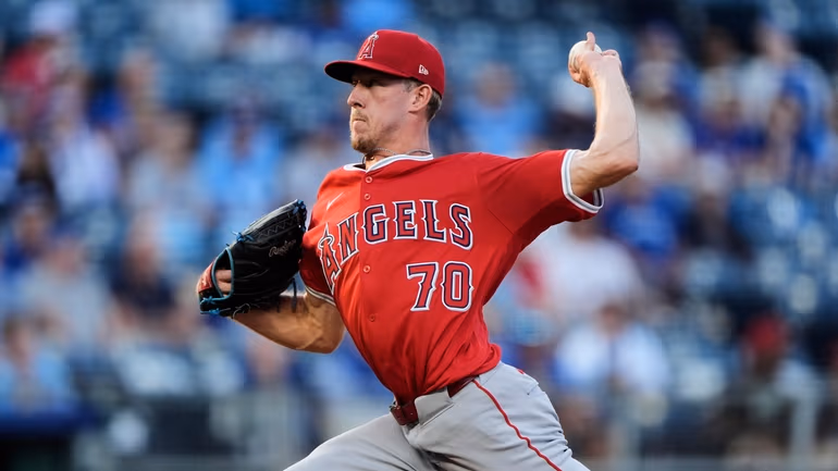 Los Angeles Angels starting pitcher Mitch Farris throws as he makes his major league debut during the first inning of a baseball game against the Kansas City Royals, Tuesday, Sept. 2, 2025, in Kansas City, Mo. (AP Photo/Charlie Riedel)
