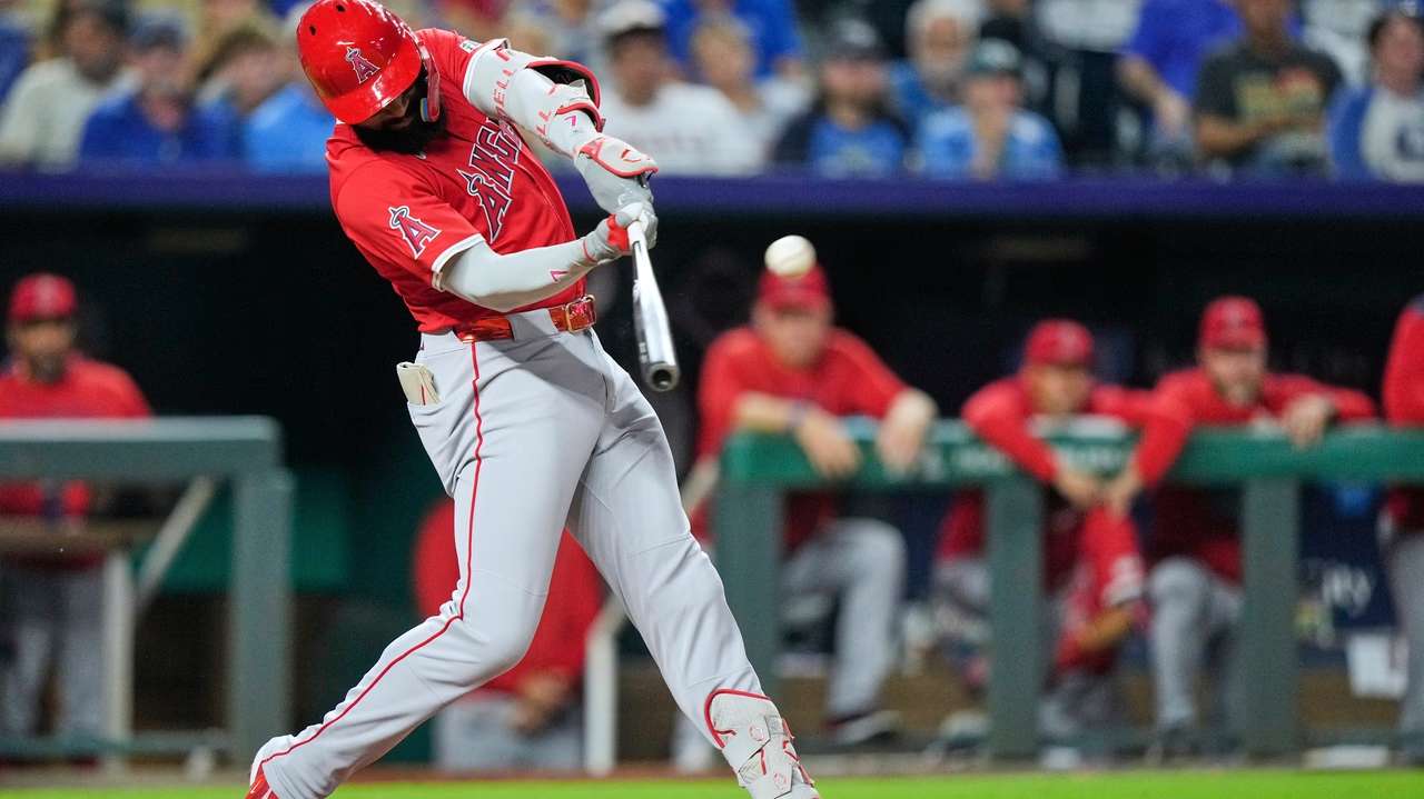 Los Angeles Angels' Jo Adell hits a three-run home run during the sixth inning of a baseball game against the Kansas City Royals, Wednesday, Sept. 3, 2025, in Kansas City, Mo. (AP Photo/Charlie Riedel)