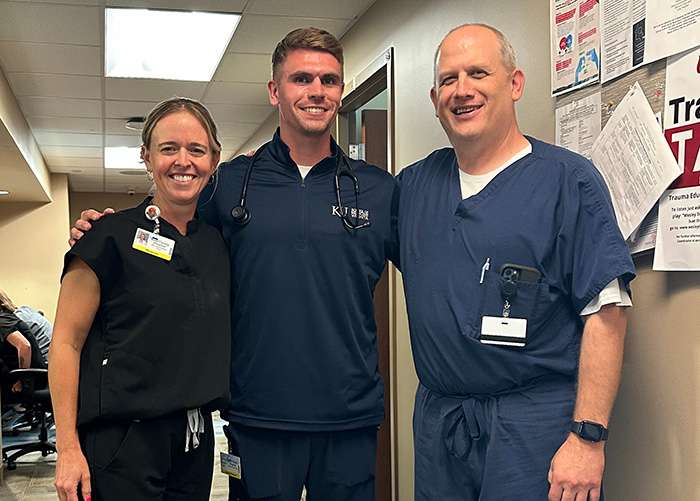 Third-year medical student Jack Thomas, center, is learning from Libby Hineman, M.D., Christopher Cupp, M.D., and their colleague (not pictured) Matthew Lightner, M.D., this summer at the Scott City Clinic. Courtesy photo