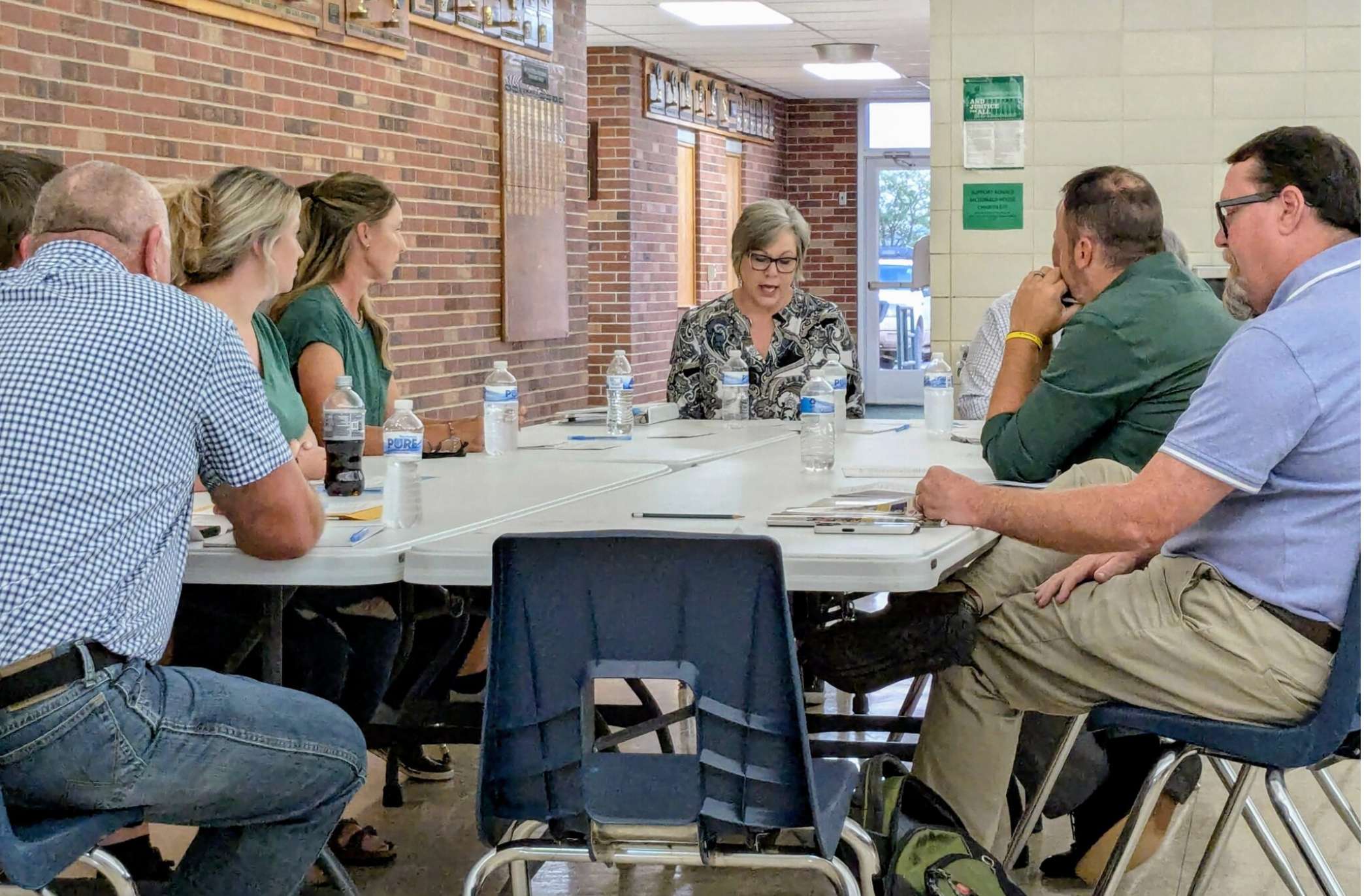 Comanche County school board president Kelly Herd addresses board members during a meeting in which the district’s superintendent was placed on paid leave pending an investigation into his alleged sexual harassment of a student. (Tim Carpenter/Kansas Reflector)