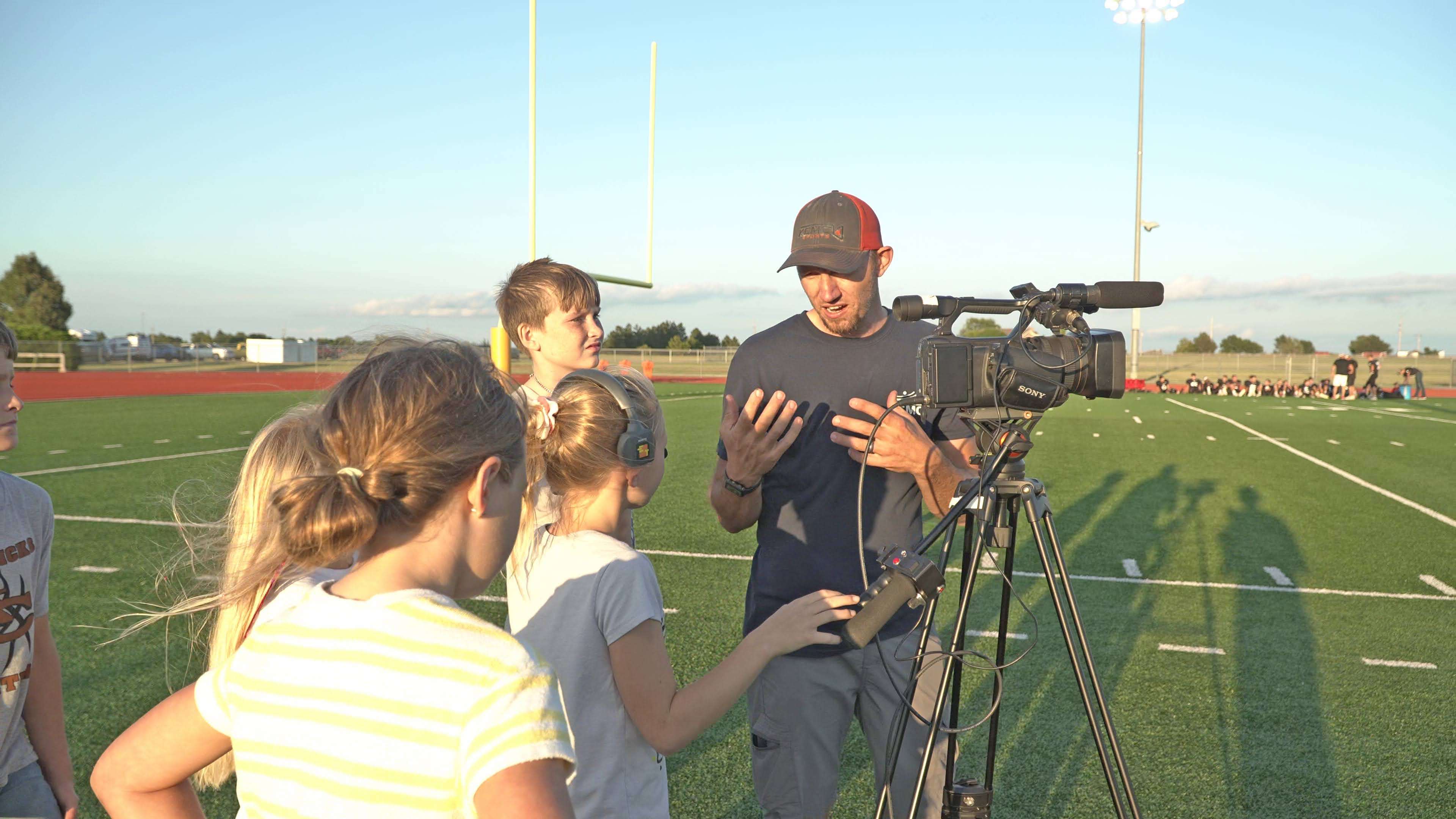 Grant Neuhold teaching the next generation of journalists about camera work.