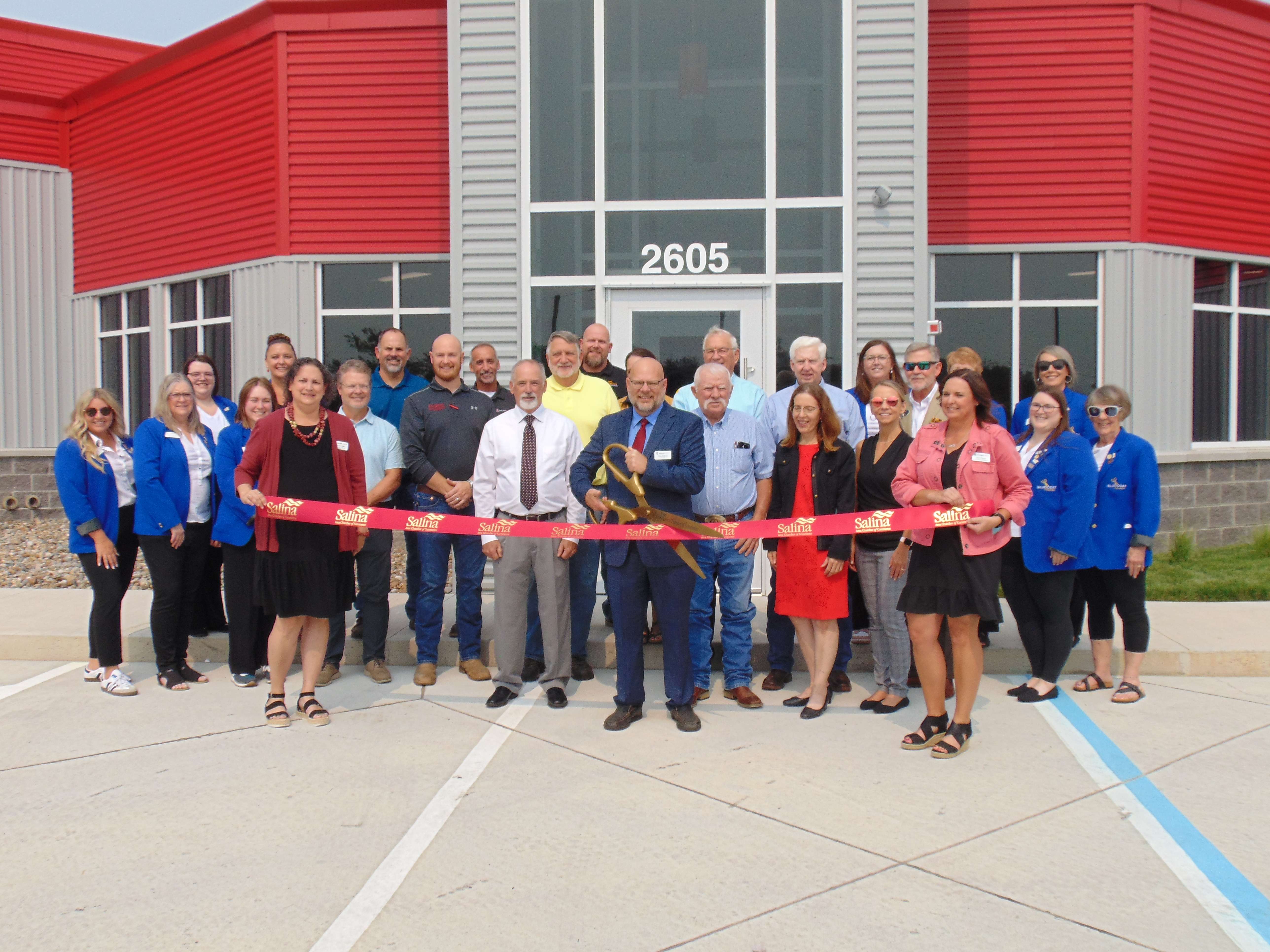 Administration and board members of Salina Area Technical College, the Salina Area Chamber of Commerce, along with donors and supporters opening the IMA building. Photo by Jacob Brown.