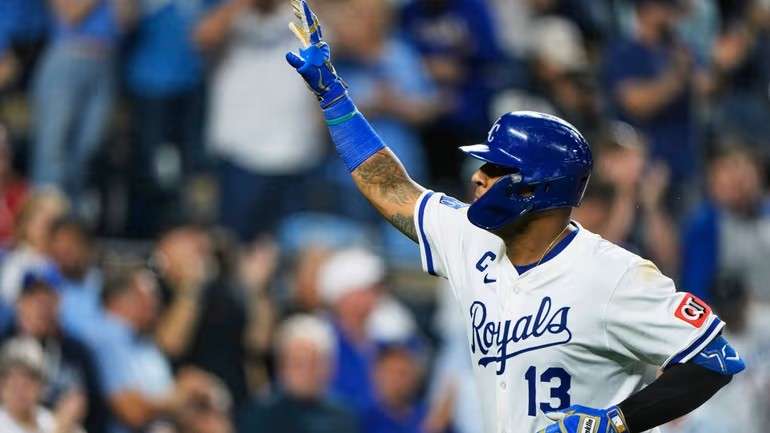 Kansas City Royals' Salvador Perez celebrates as he crosses the plate after hitting a solo home run during the seventh inning of a baseball game against the Los Angeles Angels, Thursday, Sept. 4, 2025, in Kansas City, Mo. (AP Photo/Charlie Riedel)