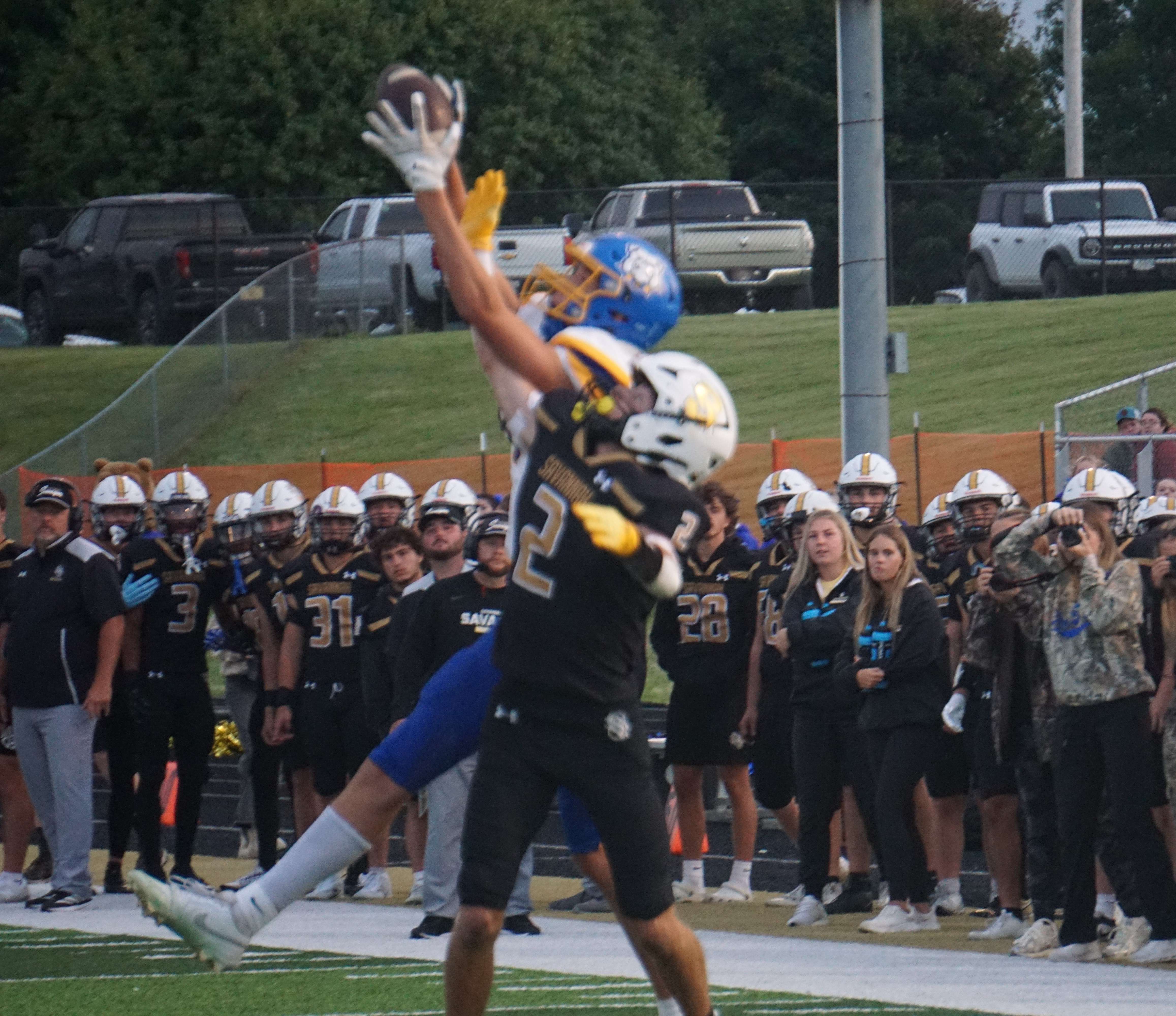Savannah's Jake Bodenhausen defends a pass against East Buchanan wide receiver Clark Scott/ Photo by Matt Pike