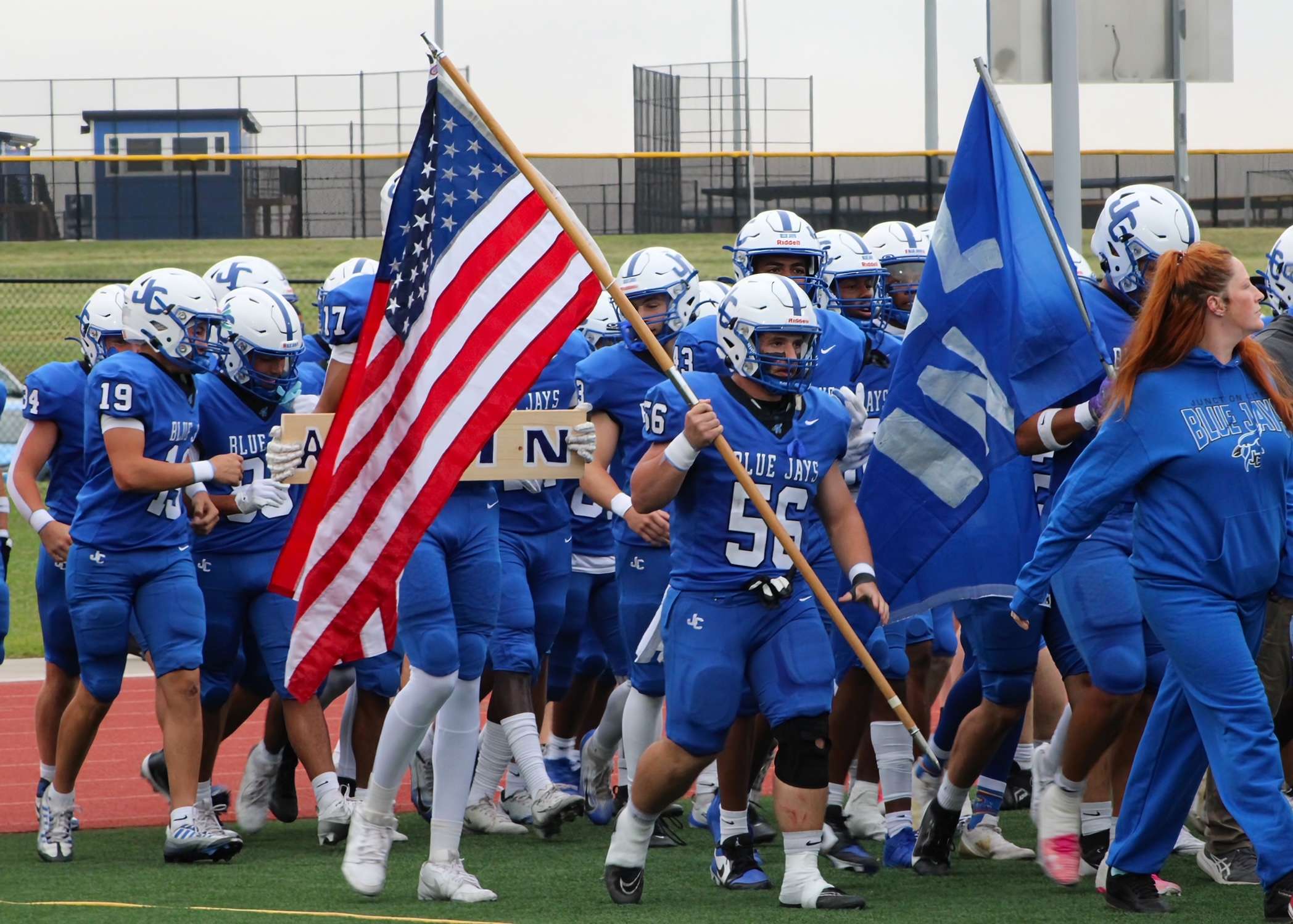 Blue Jays running onto the field.