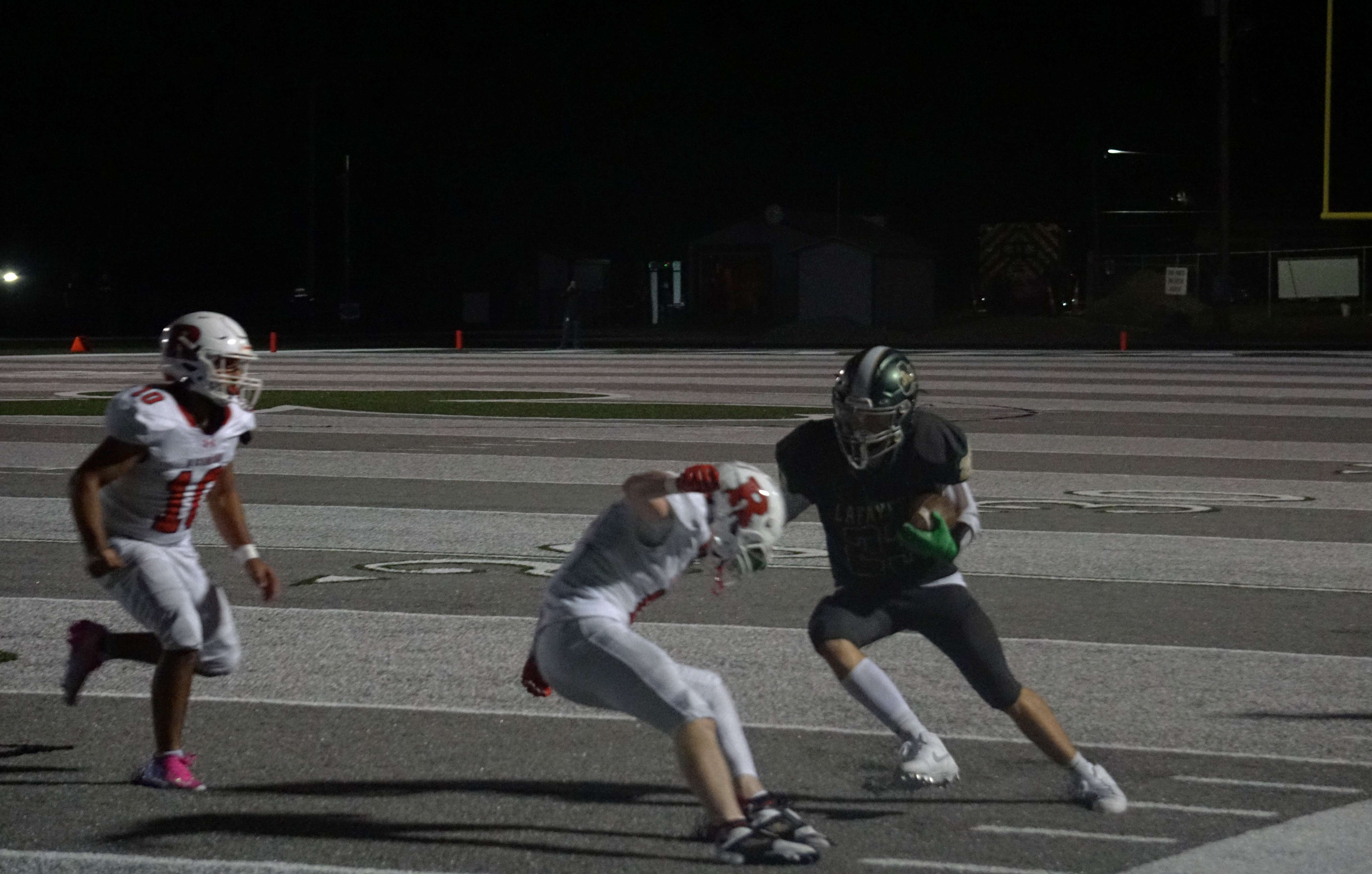 Lafayette's Maxton Puckett (23) makes a move around a defender working towards the endzone/ Photo by Matt PIke