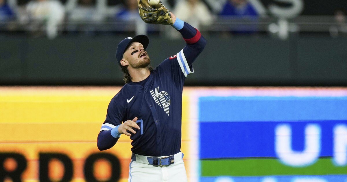 Kansas City Royals shortstop Bobby Witt Jr. catches a fly ball for the out on Minnesota Twins' Trevor Larnach during the fifth inning of a baseball game Friday, Sept. 5, 2025, in Kansas City, Mo. (AP Photo/Charlie Riedel)