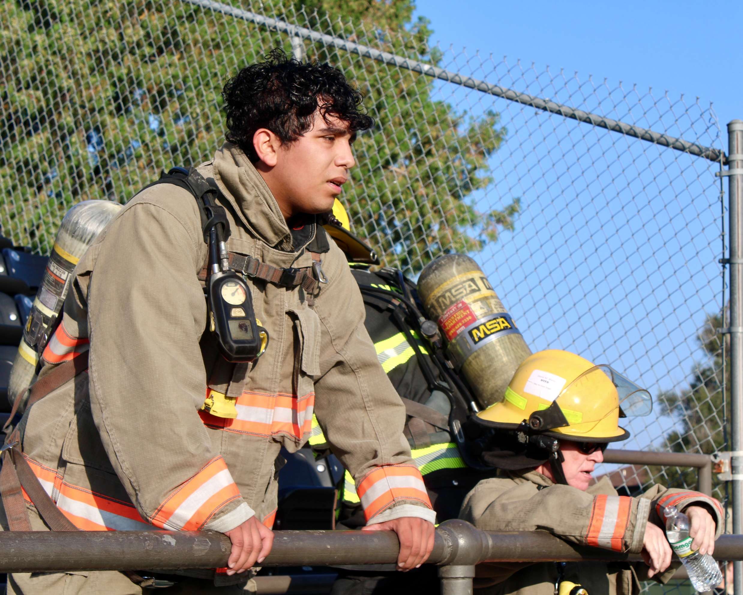 Jose Amaya with the Ellis County Fire Department resting during the Fort Hays State University 9/11 Memorial Stair Climb. Photo by Tony Guerrero/Hays Post