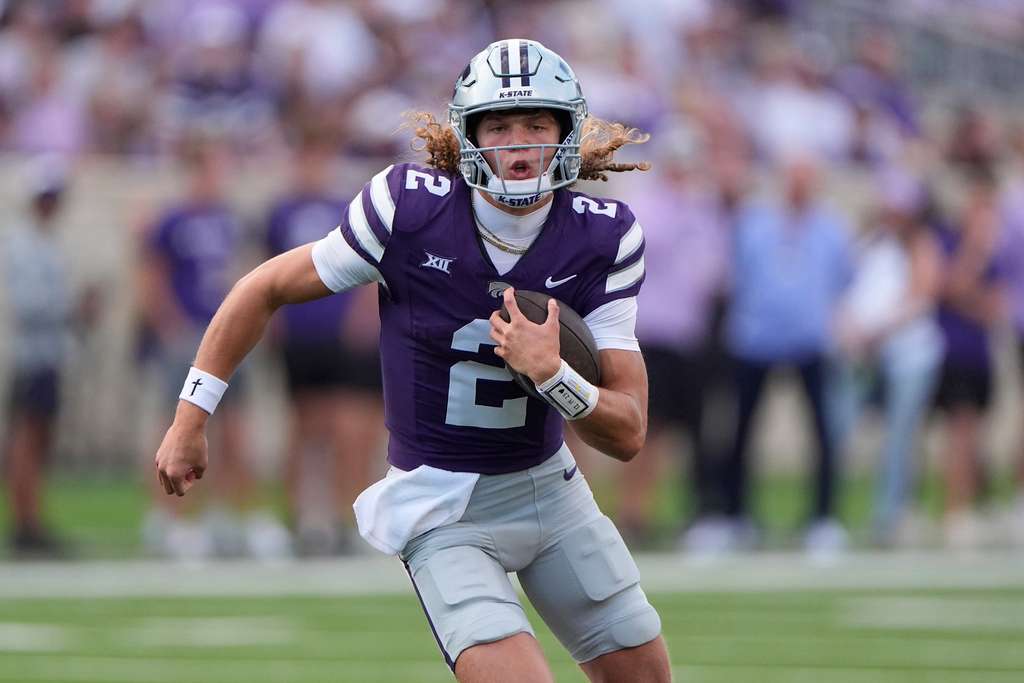 Kansas State quarterback Avery Johnson runs the ball during the first half of an NCAA college football game against Army, Saturday, Sept. 6, 2025, in Manhattan, Kan. (AP Photo/Charlie Riedel)